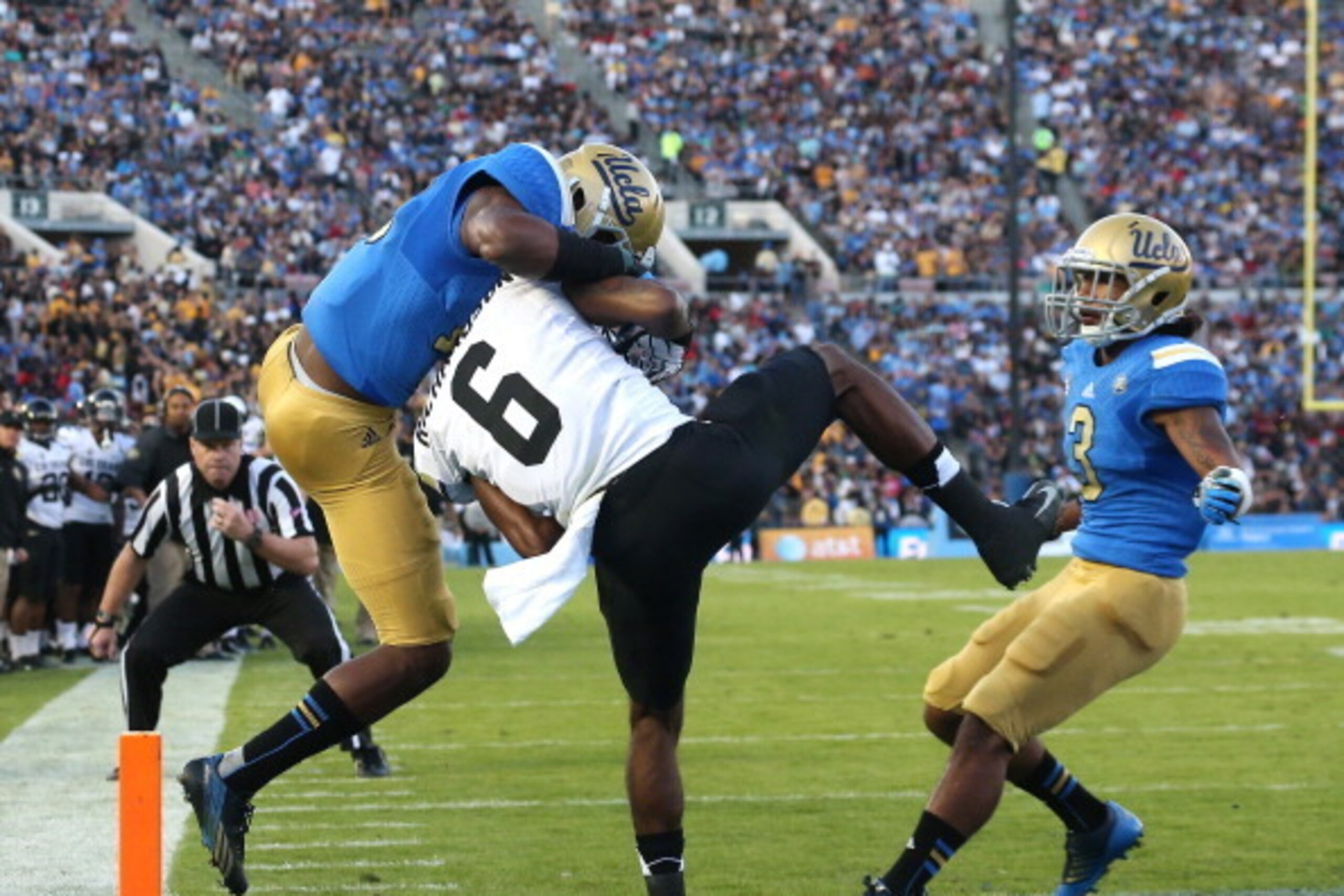 PASADENA, CA - NOVEMBER 02: Wide receiver Paul Richardson #6 of the Colorado Buffaloes makes a seven touchdown catch between defensive backs Fabian Moreau #10 and Randall Goforth #3 of the UCLA Bruins in the scond quarter at the Rose Bowl on November 2, 2