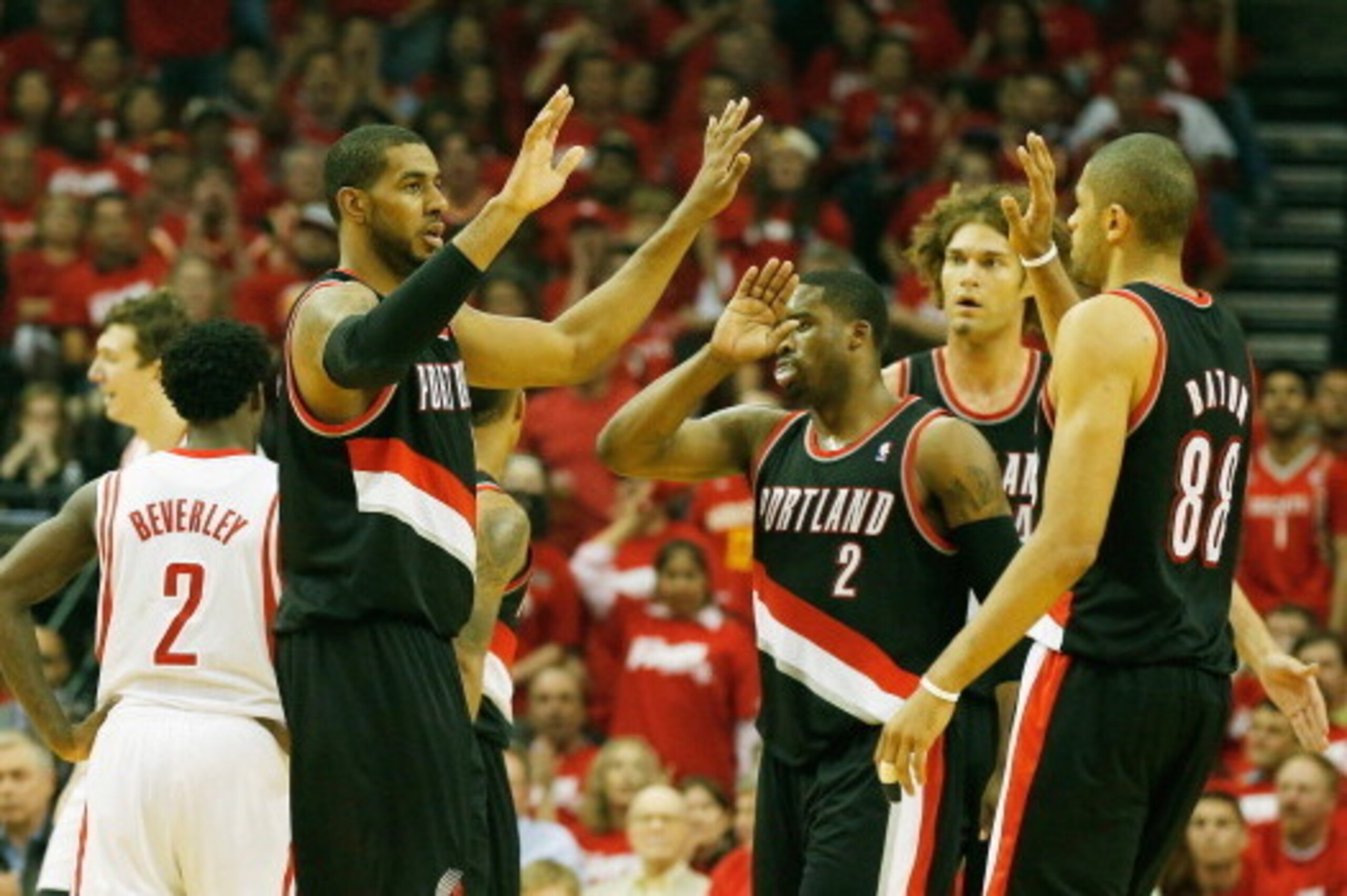 HOUSTON, TX - APRIL 23:  LaMarcus Aldridge #12, Wesley Matthews #2, Robin Lopez #4 and Nicolas Batum #88 of the Portland Trail Blazers celebrate a play on the court in the first half of the game against the Houston Rockets in Game Two of the Western Confe