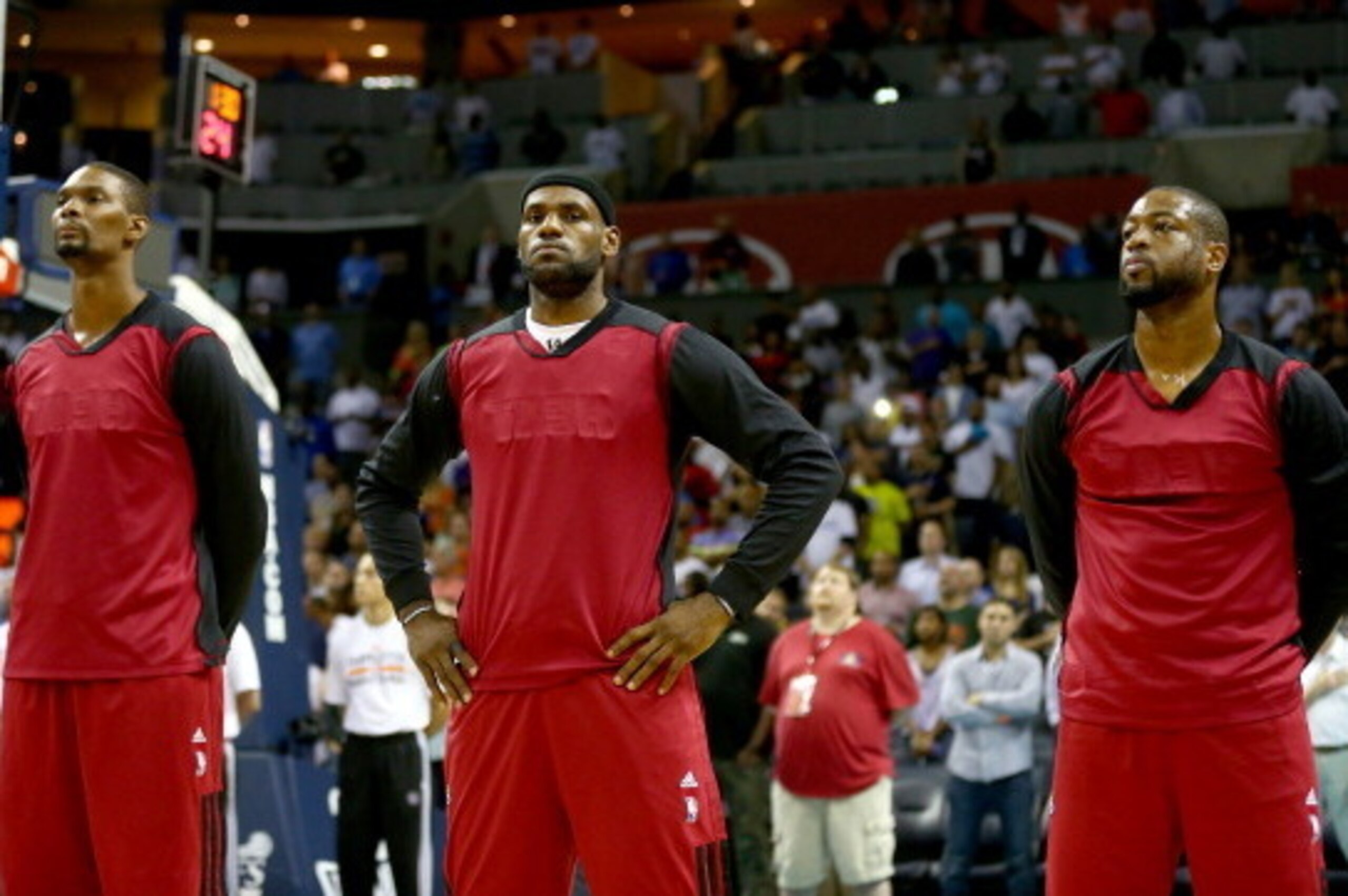 CHARLOTTE, NC - APRIL 28: Chris Bosh #1 of the Miami Heat stands alongside teammates LeBron James #6 and Dwyane Wade #3 before playing the Charlotte Bobcats in Game Four of the Eastern Conference Quarterfinals during the 2014 NBA Playoffs at Time Warner CHARLOTTE, NC - APRIL 28: Chris Bosh #1 of the Miami Heat stands alongside teammates LeBron James #6 and Dwyane Wade #3 before playing the Charlotte Bobcats in Game Four of the Eastern Conference Quarterfinals during the 2014 NBA Playoffs at Time Warner