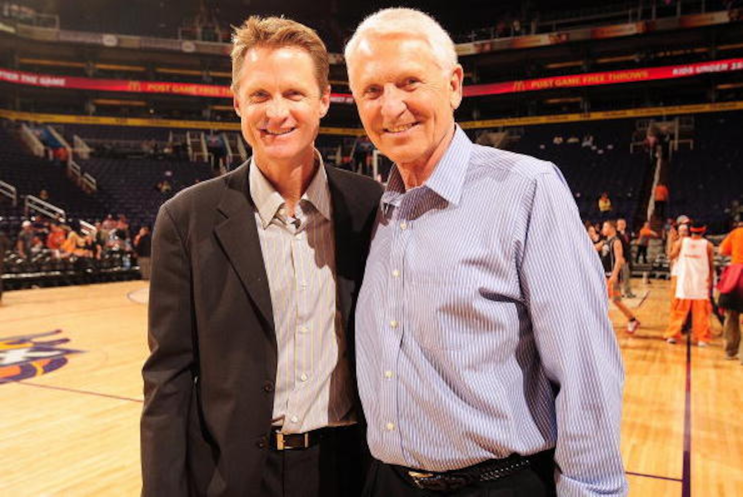 PHOENIX - NOVEMBER 25:  (L-R) President of Basketball Operations and General Manager Steve Kerr of the Phoenix Suns poses for a portrait with former University of Arizona men's basketball coach Lute Olson after the game between the Memphis Grizzlies and t