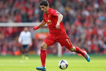 LIVERPOOL, ENGLAND - MARCH 30:  Luis Suarez of Liverpool in action during the Barclays Premier League match between Liverpool and Tottenham Hotspur at Anfield on March 30, 2014 in Liverpool, England.  (Photo by Alex Livesey/Getty Images)