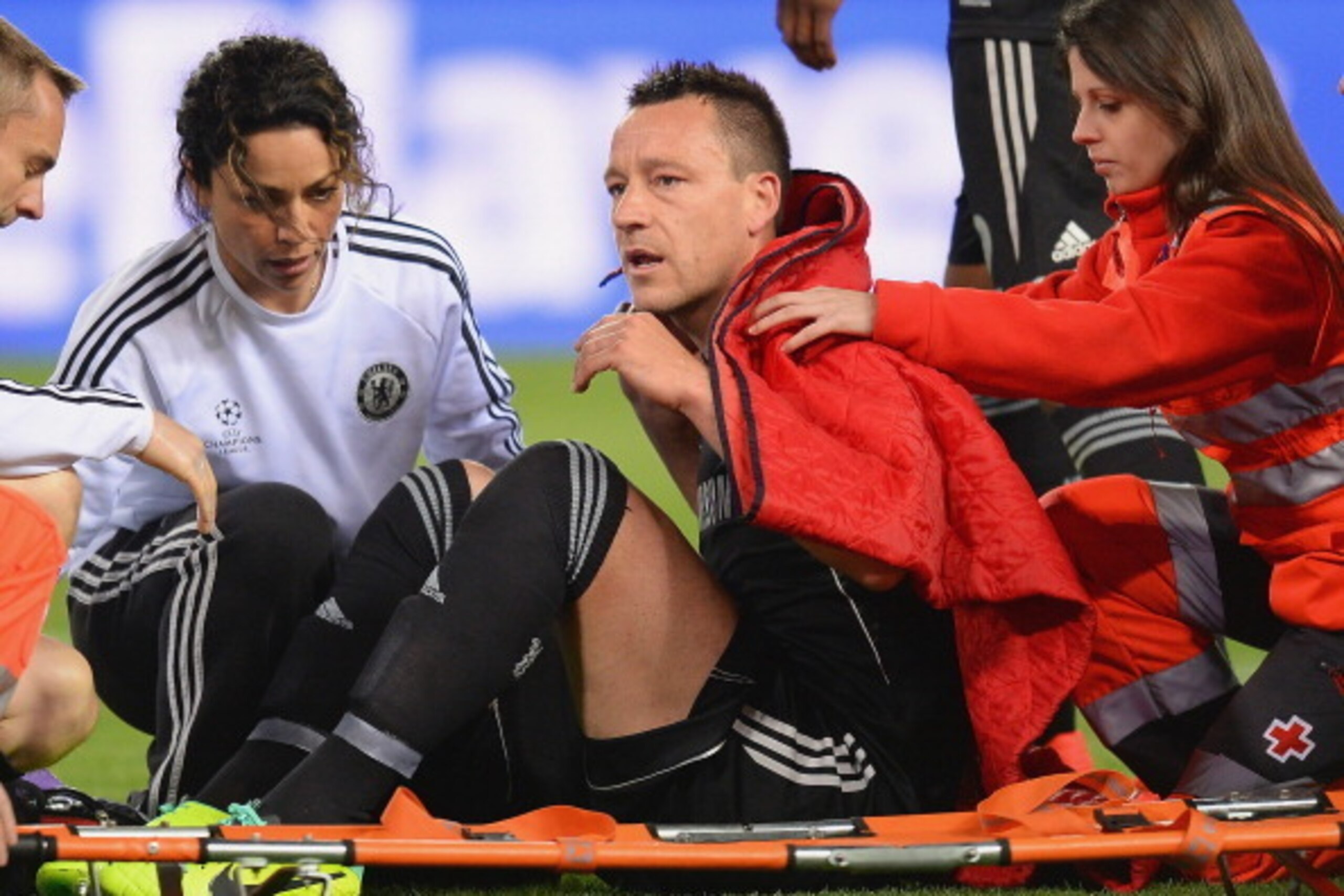 MADRID, SPAIN - APRIL 22:  An injured John Terry of Chelsea receives treatment during the UEFA Champions League Semi Final first leg match between Club Atletico de Madrid and Chelsea at Vicente Calderon Stadium on April 22, 2014 in Madrid, Spain.  (Photo 