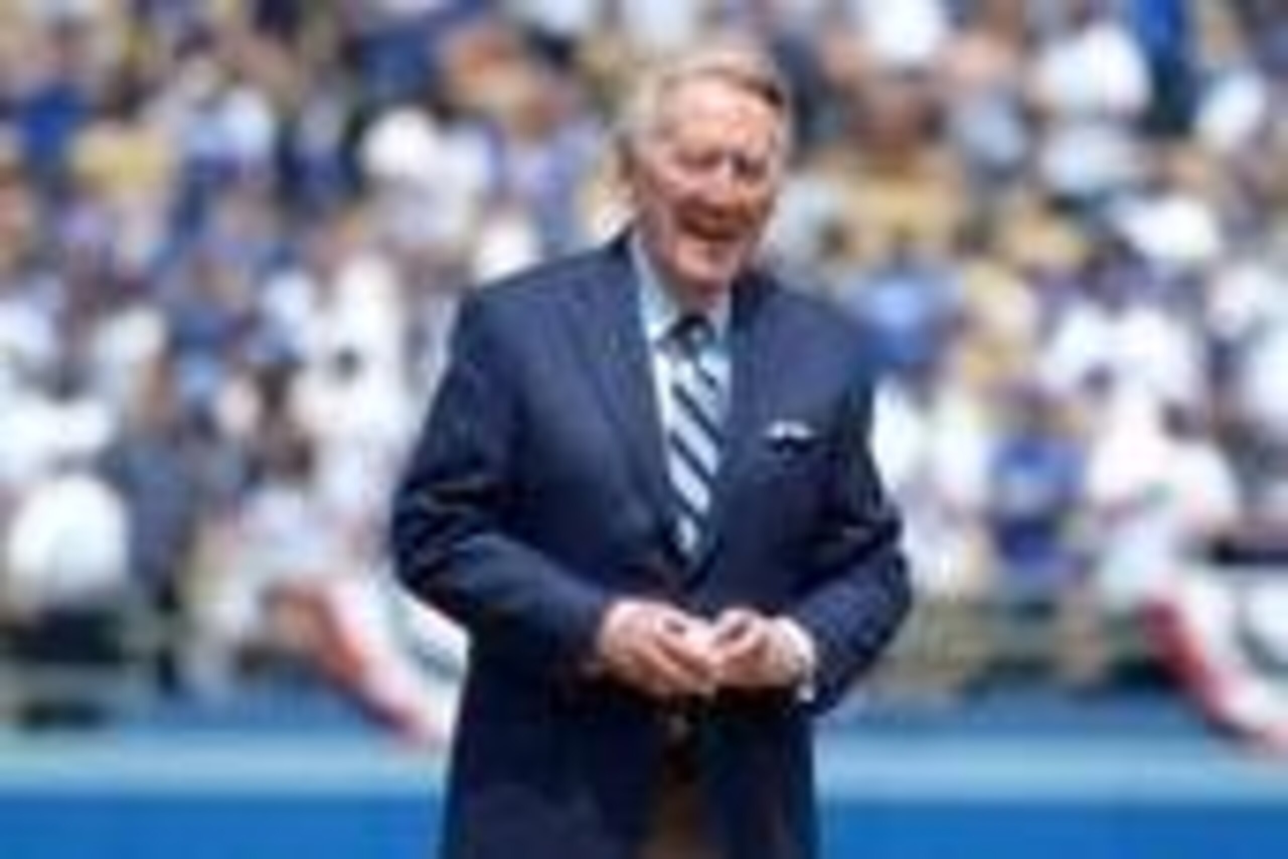 Apr 4, 2014; Los Angeles, CA, USA; Los Angeles Dodgers broadcaster Vin Scully prepares to throw out the ceremonial first pitch before the 2014 season home opening game against the San Francisco Giants at Dodger Stadium. Mandatory Credit: Kirby Lee-USA TOD