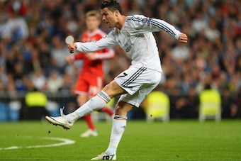 MADRID, SPAIN - APRIL 23:  Cristiano Ronaldo of Real Madrid shoots during the UEFA Champions League semi-final first leg match between Real Madrid and FC Bayern Muenchen at the Estadio Santiago Bernabeu on April 23, 2014 in Madrid, Spain.  (Photo by Mike 