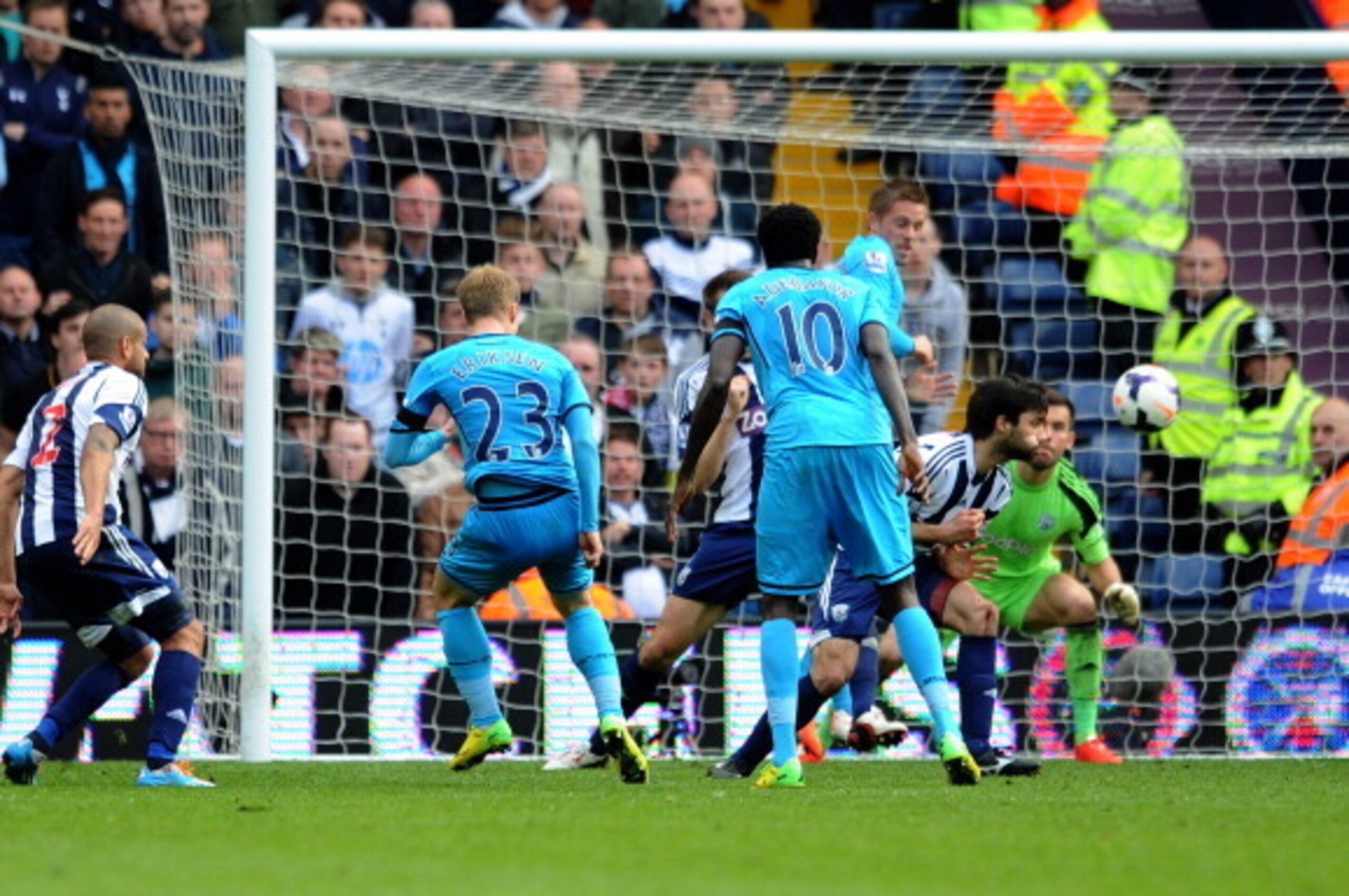 WEST BROMWICH, ENGLAND - APRIL 12:  Christian Eriksen #23 of Spurs celebrates after scoring his team's third goal deep in injury time during the Barclays Premier League match between West Bromwich Albion and Tottenham Hotspur at The Hawthorns on April 12,