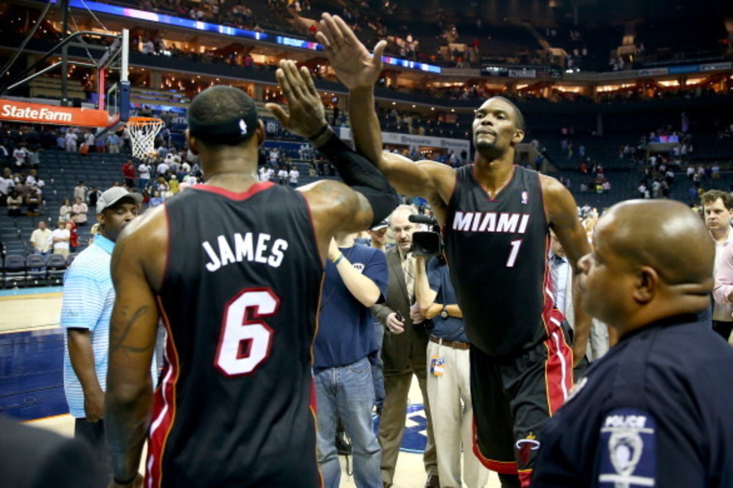 CHARLOTTE, NC - APRIL 28:  LeBron James #6 of the Miami Heat celebrates with teammate Chris Bosh after defeating the Charlotte Bobcats 109-98 in Game Four of the Eastern Conference Quarterfinals during the 2014 NBA Playoffs at Time Warner Cable Arena on A