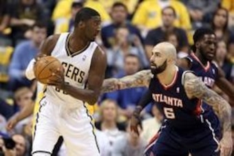 Apr 22, 2014; Indianapolis, IN, USA; Indiana Pacers center Roy Hibbert (55) posts up against Atlanta Hawks center Pero Antic (6) in game two during the first round of the 2014 NBA Playoffs at Bankers Life Fieldhouse. Mandatory Credit: Brian Spurlock-USA T