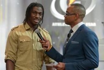 Jul 10, 2012; Hollywood, CA, USA; ESPN sportscenter anchor Stuart Scott (right) interviews Washington Redskins quarterback Robert Griffin III at the 2012 Gatorade national athlete of the year awards ceremony at the Loews Hollywood Hotel. Mandatory Credit: