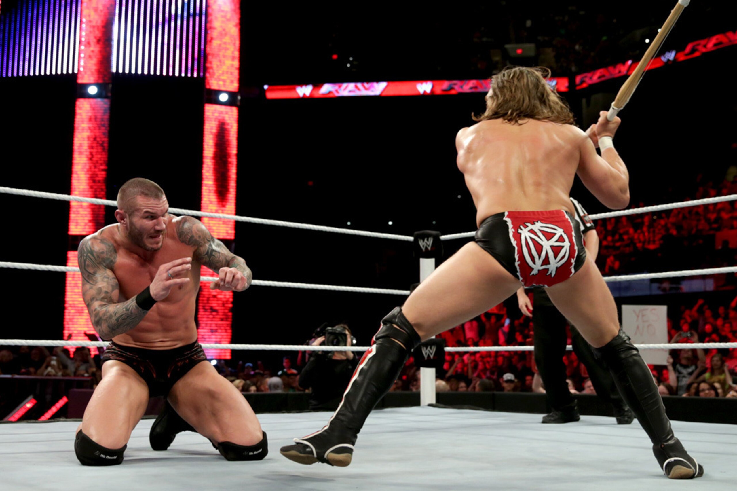 Daniel Bryan set to crack Randy Orton with a kendo stick. Count this among things we won't see in The Shield vs. Evolution