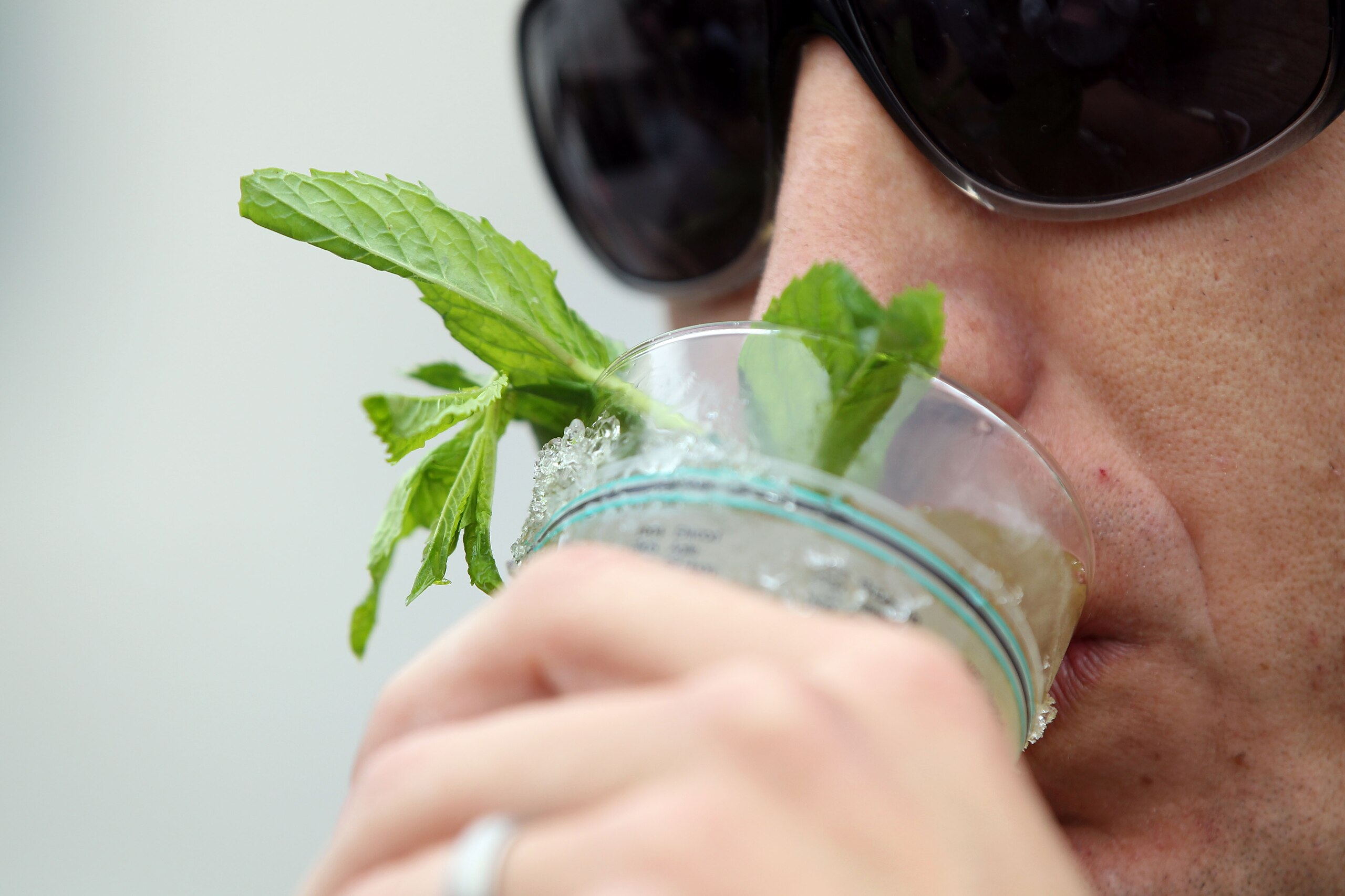 LOUISVILLE, KY - MAY 07: A fan drinks a mint julep in the paddock area during the 137th Kentucky Derby at Churchill Downs on May 7, 2011 in Louisville, Kentucky. (Photo by Jamie Squire/Getty Images) LOUISVILLE, KY - MAY 07: A fan drinks a mint julep in the paddock area during the 137th Kentucky Derby at Churchill Downs on May 7, 2011 in Louisville, Kentucky. (Photo by Jamie Squire/Getty Images)