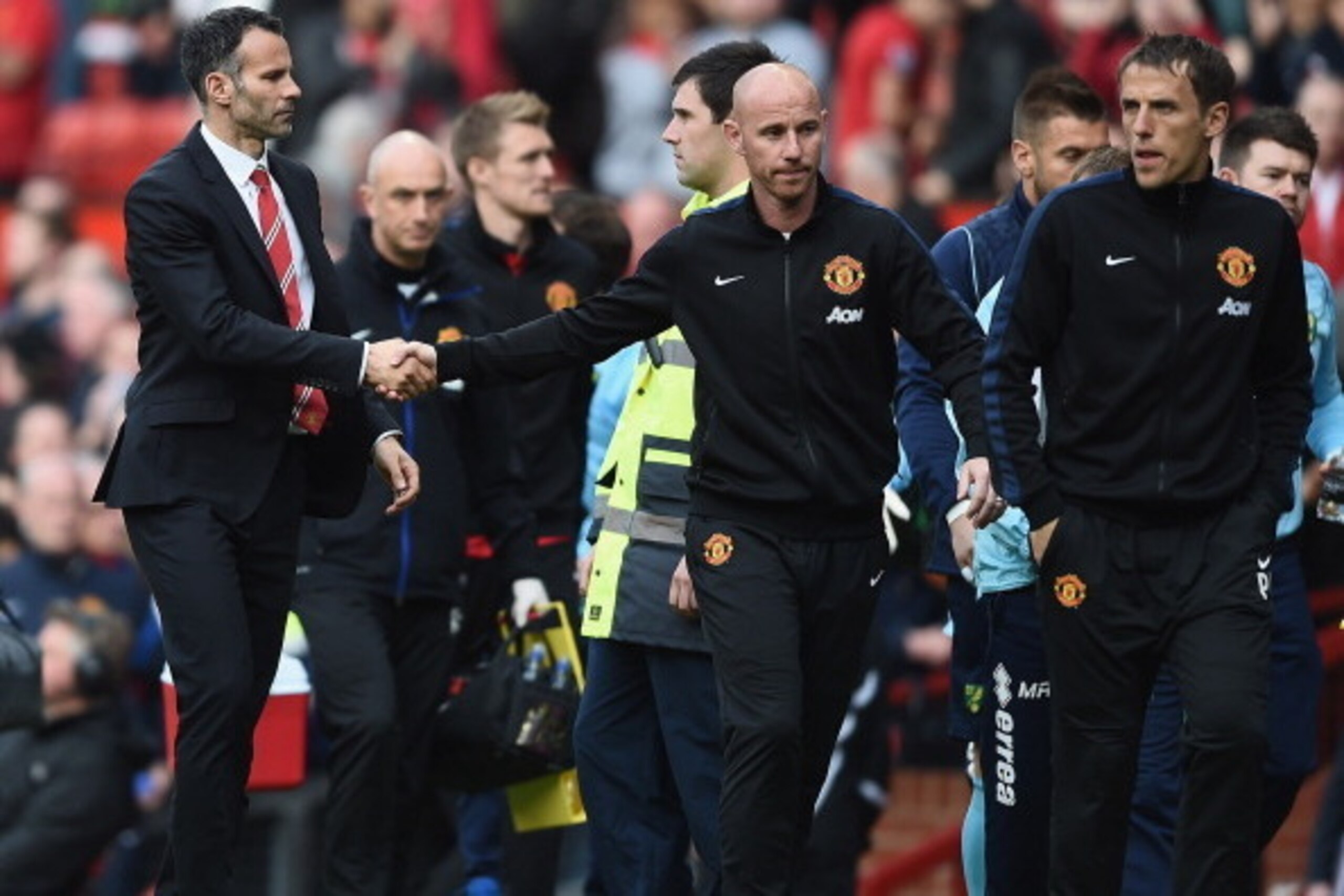 MANCHESTER, ENGLAND - APRIL 26: Ryan Giggs of Manchester United shakes hands with Nicky Butt after the Barclays Premier League match between Manchester United and Norwich City at Old Trafford on April 26, 2014 in Manchester, England.  (Photo by Laurence G