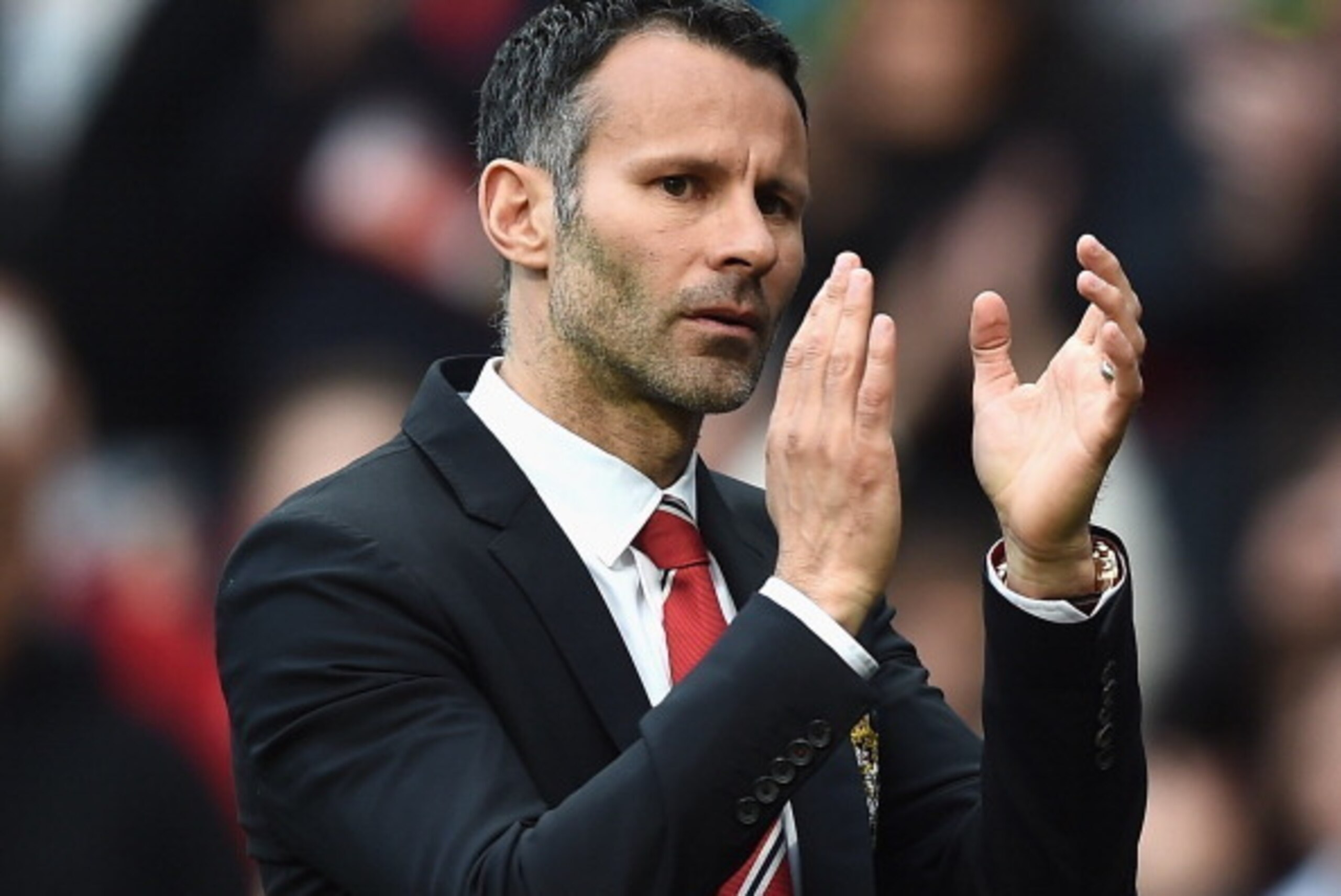 MANCHESTER, ENGLAND - APRIL 26:  Ryan Giggs of Manchester United applauds the fans after a rousing victory in his first match as manager during the Barclays Premier League match between Manchester United and Norwich City at Old Trafford on April 26, 2014 