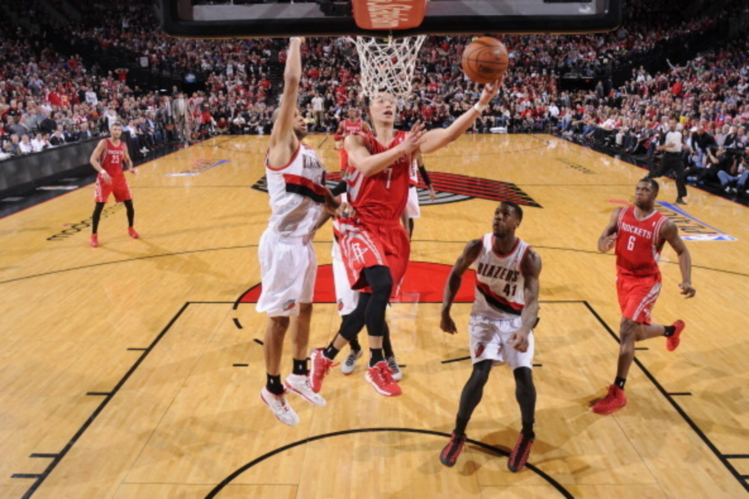 PORTLAND, OR - APRIL 25: Jeremy Lin #7 of the Houston Rockets drives to the basket against the Portland Trail Blazers in Game Three of the Western Conference Quarterfinals during the 2014 NBA Playoffs on April 25, 2014 at the Moda Center in Portland, Ore PORTLAND, OR - APRIL 25: Jeremy Lin #7 of the Houston Rockets drives to the basket against the Portland Trail Blazers in Game Three of the Western Conference Quarterfinals during the 2014 NBA Playoffs on April 25, 2014 at the Moda Center in Portland, Ore