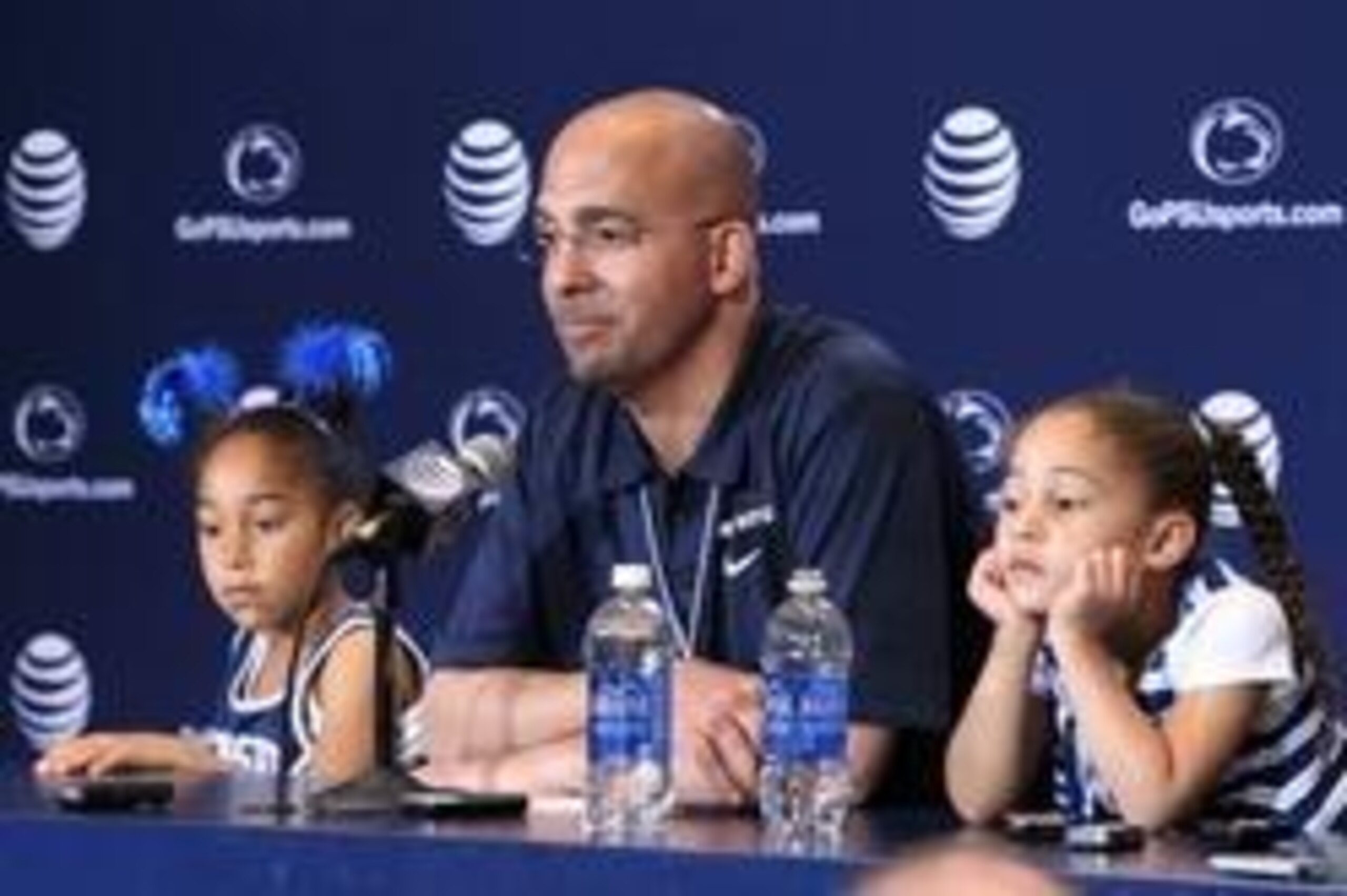 Apr 12, 2014; State College, PA, USA; Penn State Nittany Lions head coach James Franklin answers questions from the media as his daughters Shola Franklin (left) and Addison Franklin (right) look on following the completion of the Blue White spring game at