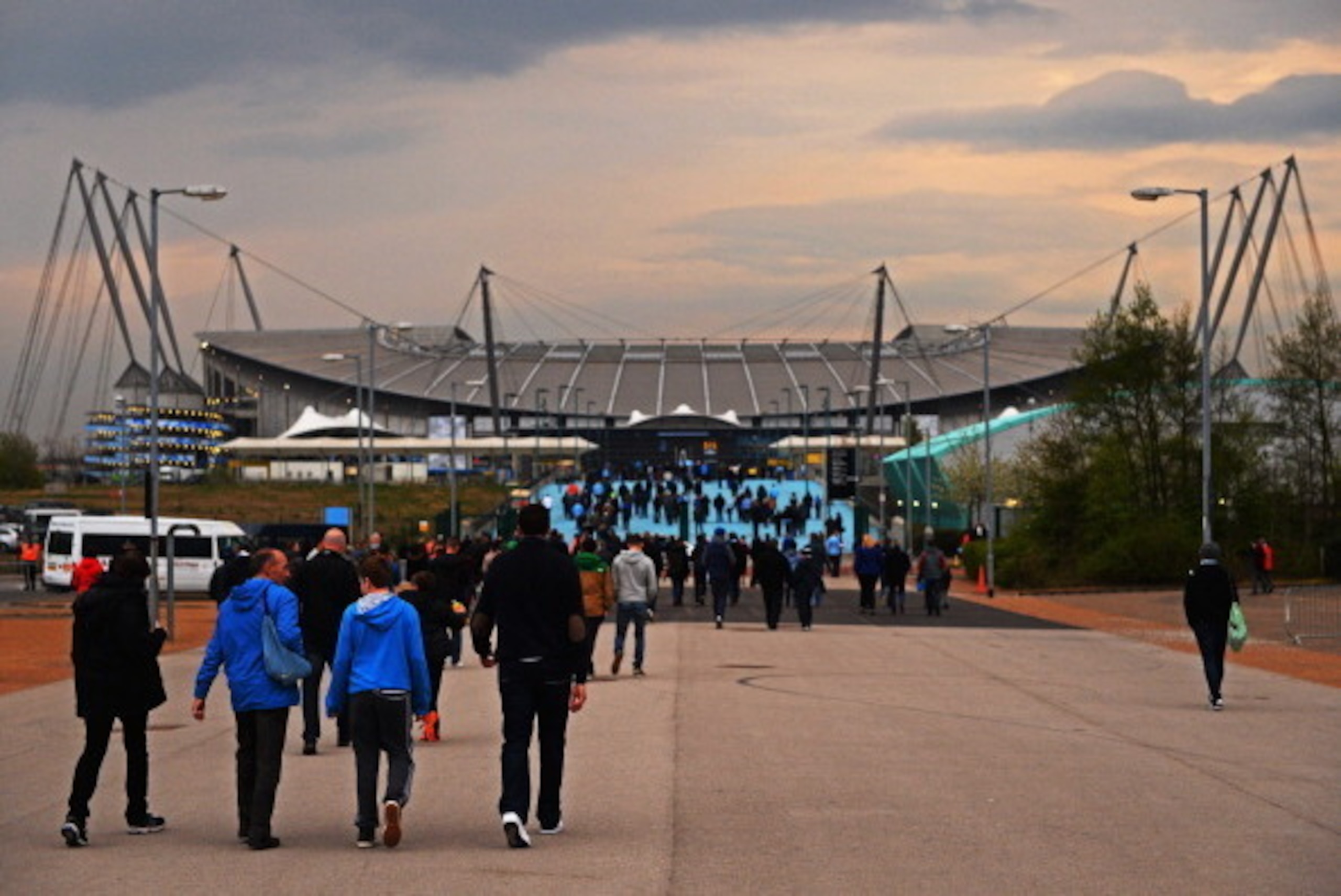 MANCHESTER, ENGLAND - APRIL 21:  Fans walk to the ground prior to the Barclays Premier League match between Manchester City and West Bromwich Albion at Etihad Stadium on April 21, 2014 in Manchester, England.  (Photo by Laurence Griffiths/Getty Images)
