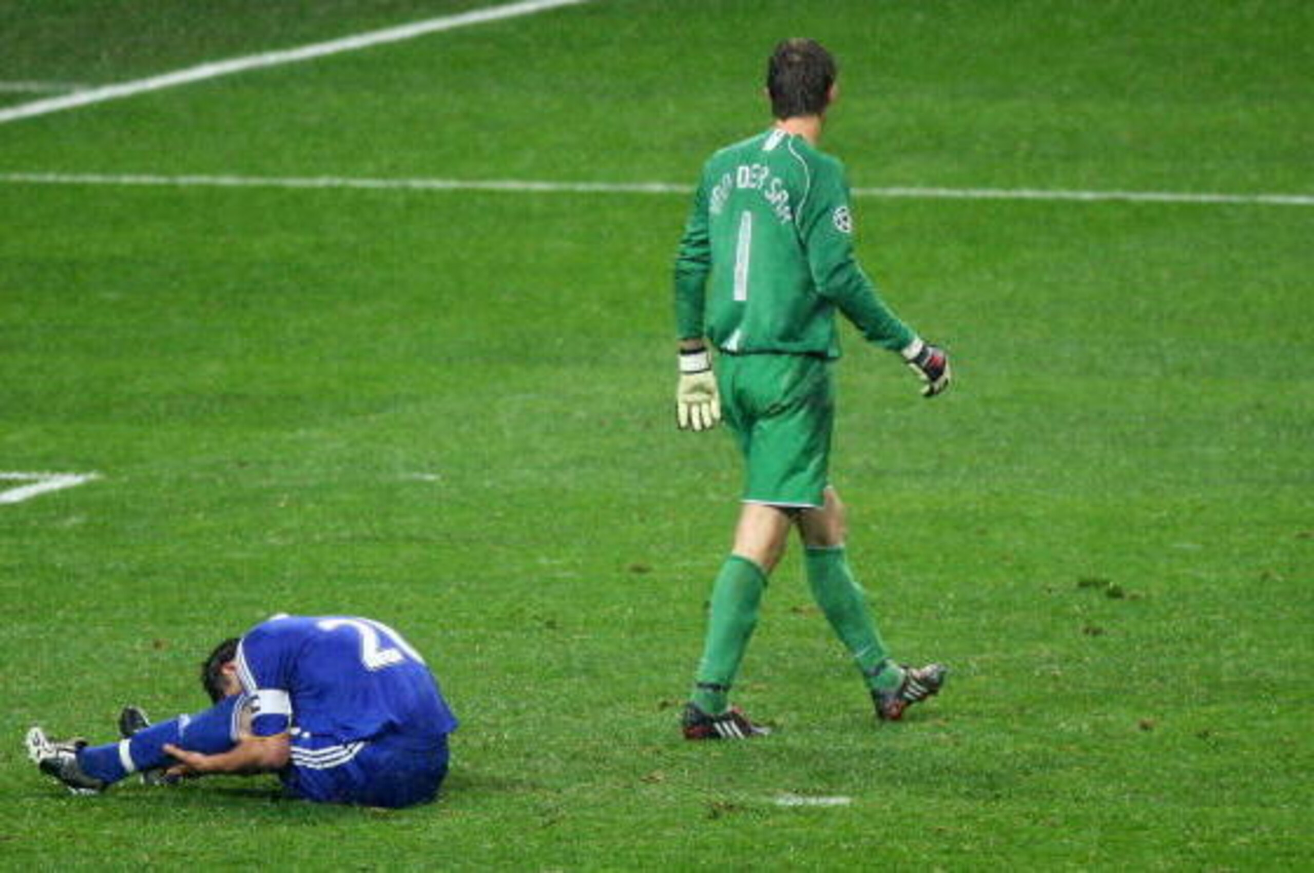 MOSCOW - MAY 21:  Edwin Van der Sar of Manchester United walks past John Terry of Chelsea, who has just missed a penalty attempt during the UEFA Champions League Final match between Manchester United and Chelsea at the Luzhniki Stadium on May 21, 2008 in 