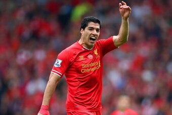 LIVERPOOL, ENGLAND - APRIL 27:  Luis Suarez of Liverpool signals during the Barclays Premier League match between Liverpool and Chelsea at Anfield on April 27, 2014 in Liverpool, England.  (Photo by Clive Brunskill/Getty Images)