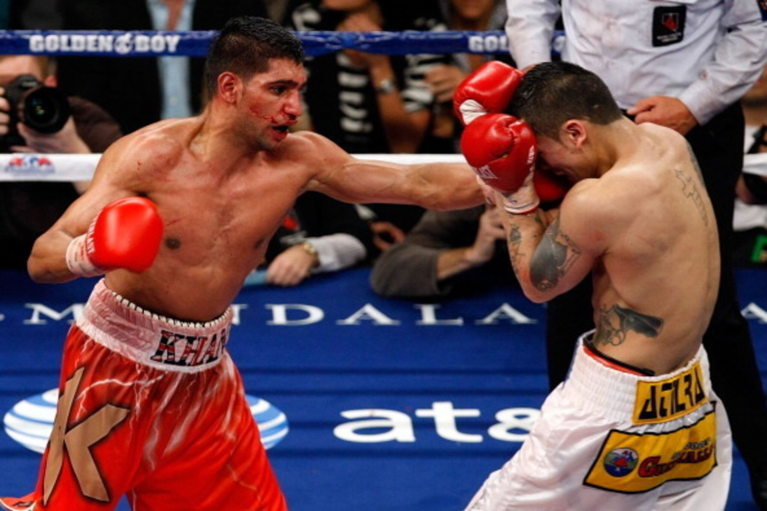 LAS VEGAS - DECEMBER 11:  (L-R) Amir Khan of England throws a left to the face of Marcos Maidana of Argentina during the WBA super lightweight title fight at Mandalay Bay Events Center on December 11, 2010 in Las Vegas, Nevada.  (Photo by Ethan Miller/Get