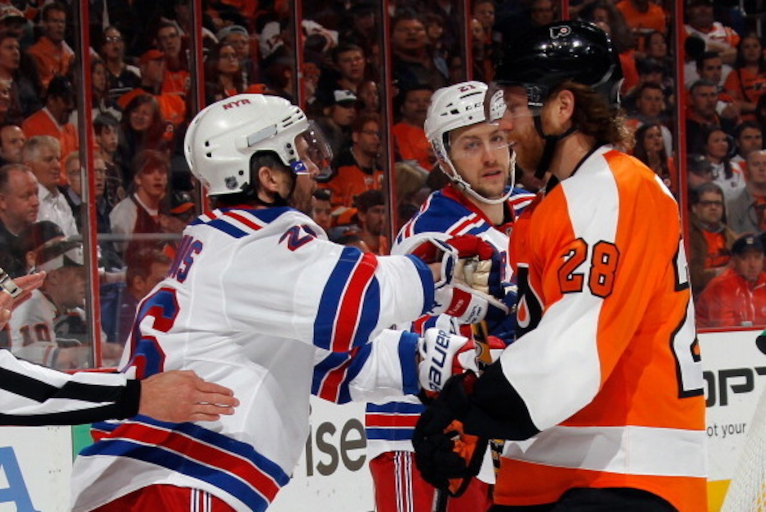 PHILADELPHIA, PA - APRIL 29: Martin St. Louis #26 of the New York Rangers hits Claude Giroux #28 of the Philadelphia Flyers during the first period in Game Six of the First Round of the 2014 NHL Stanley Cup Playoffs at the Wells Fargo Center on April 29, 