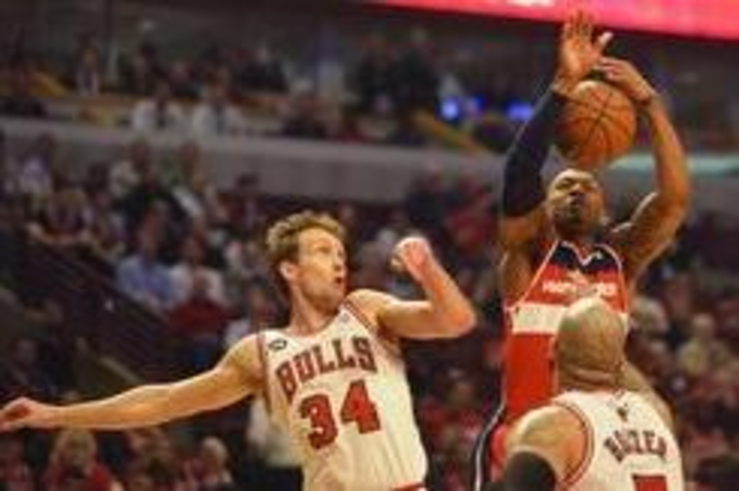 Apr 29, 2014; Chicago, IL, USA; Washington Wizards guard Bradley Beal (3) shoots the ball as Chicago Bulls forward Mike Dunleavy (34) and forward Carlos Boozer (5) defend in the first half in game five of the first round of the 2014 NBA Playoffs at United Apr 29, 2014; Chicago, IL, USA; Washington Wizards guard Bradley Beal (3) shoots the ball as Chicago Bulls forward Mike Dunleavy (34) and forward Carlos Boozer (5) defend in the first half in game five of the first round of the 2014 NBA Playoffs at United