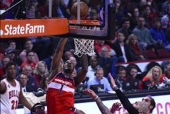 Apr 29, 2014; Chicago, IL, USA; Washington Wizards forward Trevor Ariza (1) shoots the ball against the Chicago Bulls during the first quarter in game five of the first round of the 2014 NBA Playoffs at United Center. Mandatory Credit: Mike DiNovo-USA TOD Apr 29, 2014; Chicago, IL, USA; Washington Wizards forward Trevor Ariza (1) shoots the ball against the Chicago Bulls during the first quarter in game five of the first round of the 2014 NBA Playoffs at United Center. Mandatory Credit: Mike DiNovo-USA TOD