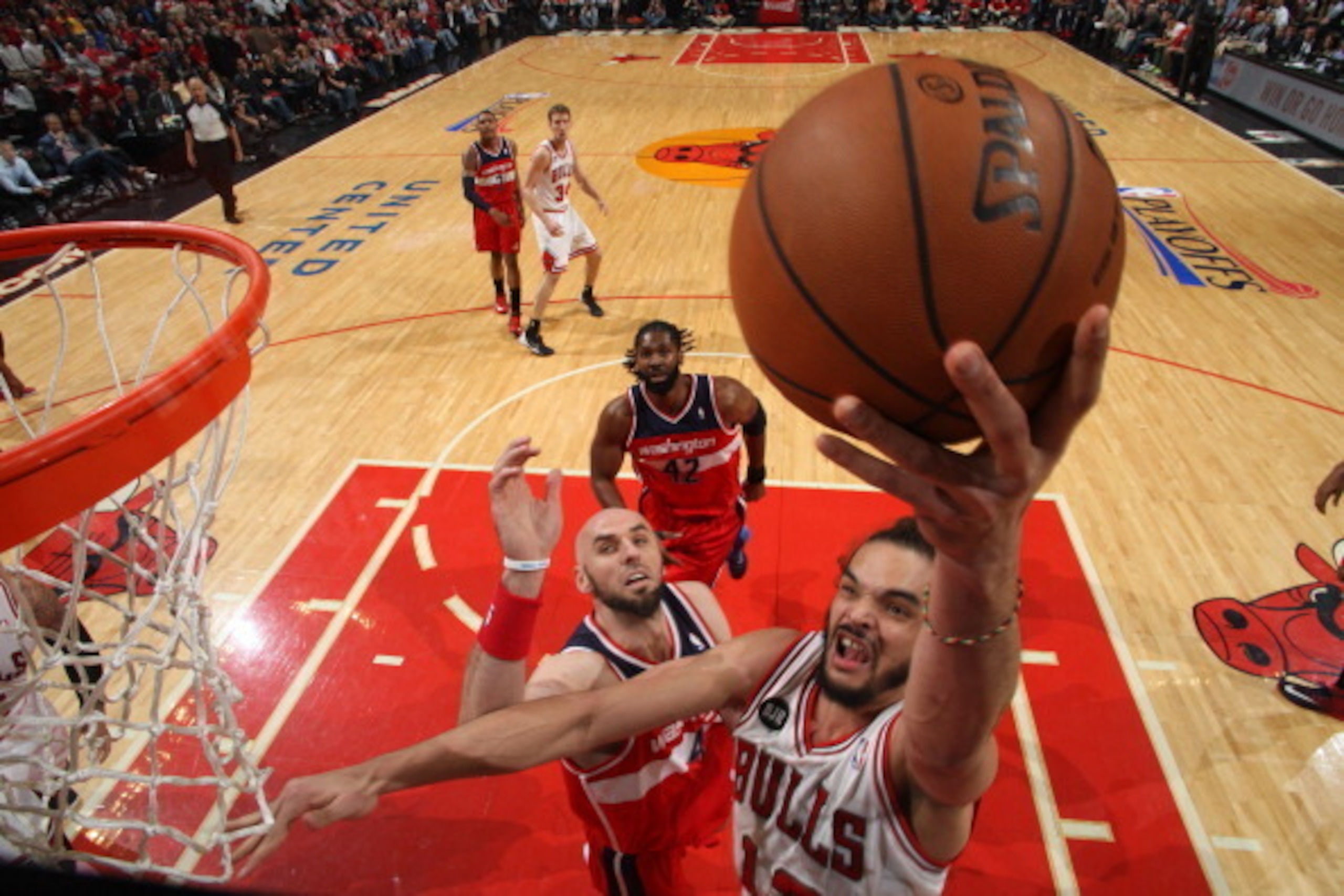 CHICAGO, IL - APRIL 29: Joakim Noah #13 of the Chicago Bulls shoots against Marcin Gortat #4 of the Washington Wizards in Game 5 of the Eastern Conference Quarterfinals in the 2014 NBA Playoffs on April 29, 2014 at the United Center in Chicago, Illinois. CHICAGO, IL - APRIL 29: Joakim Noah #13 of the Chicago Bulls shoots against Marcin Gortat #4 of the Washington Wizards in Game 5 of the Eastern Conference Quarterfinals in the 2014 NBA Playoffs on April 29, 2014 at the United Center in Chicago, Illinois.