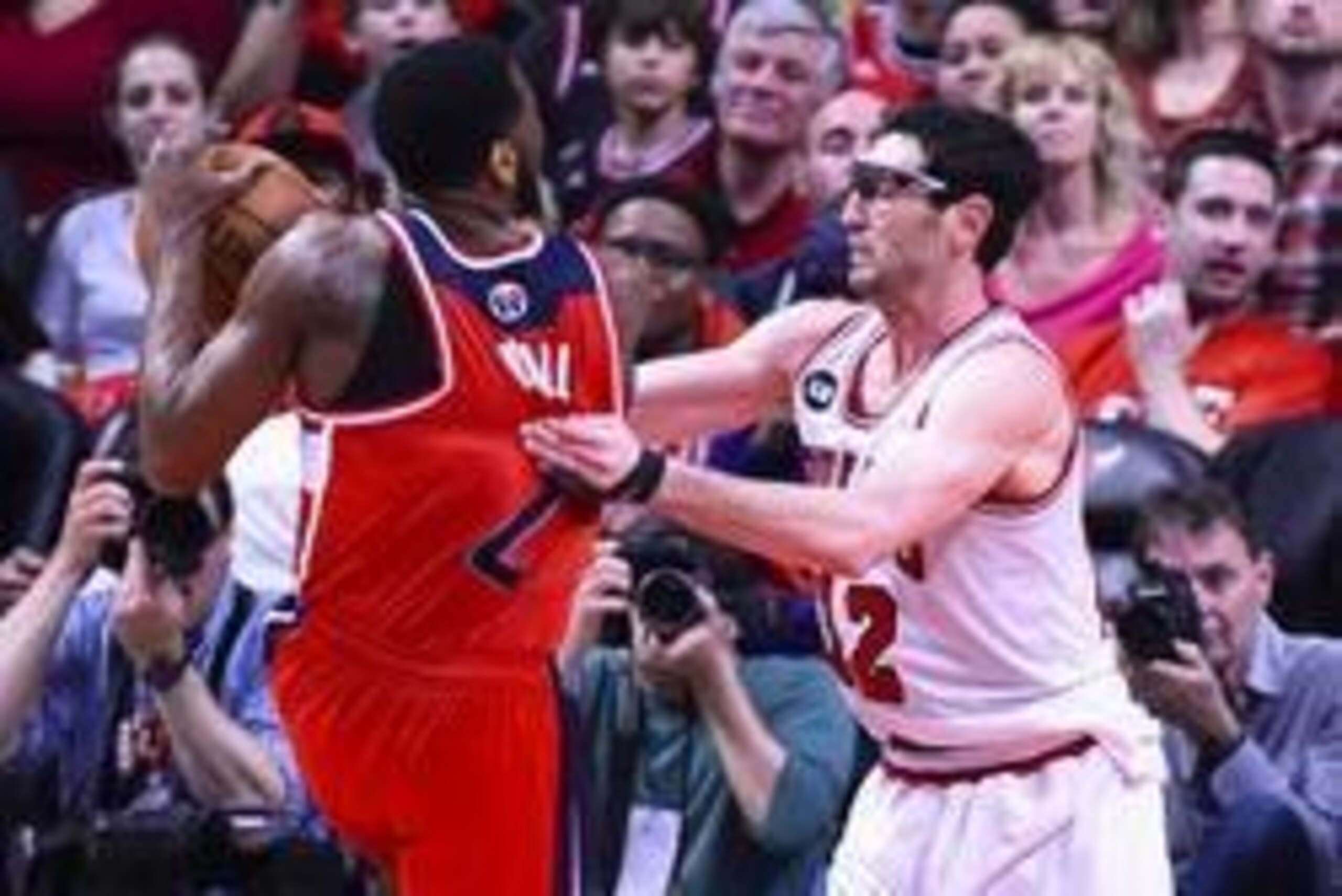Apr 29, 2014; Chicago, IL, USA; Chicago Bulls guard Kirk Hinrich (12) fouls Washington Wizards guard John Wall (2) during the second half in game five of the first round of the 2014 NBA Playoffs at United Center. The Wizards won 75-69 and won the series 4 Apr 29, 2014; Chicago, IL, USA; Chicago Bulls guard Kirk Hinrich (12) fouls Washington Wizards guard John Wall (2) during the second half in game five of the first round of the 2014 NBA Playoffs at United Center. The Wizards won 75-69 and won the series 4