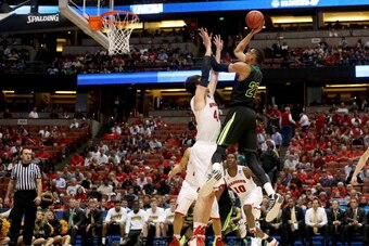ANAHEIM, CA - MARCH 27:  Isaiah Austin #21 of the Baylor Bears shoots over Frank Kaminsky #44 of the Wisconsin Badgers in the second half during the regional semifinal of the 2014 NCAA Men's Basketball Tournament at the Honda Center on March 27, 2014 in A