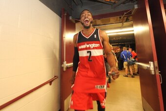 CHICAGO, IL - APRIL 29: John Wall #2 of the Washington Wizards celebrates after Game 5 of the Eastern Conference Quarterfinals against the Chicago Bulls in the 2014 NBA Playoffs on April 29, 2014 at the United Center in Chicago, Illinois. NOTE TO USER: Us