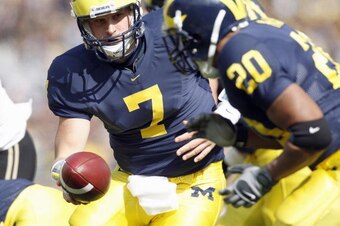 ANN ARBOR, MI - OCTOBER 13: Chad Henne #7 of the Michigan Wolverines hands off the ball to Mike Hart #20 during the game against the Purdue Boilermakers on October 13, 2007 at Michigan Stadium in Ann Arbor, Michigan. (Photo By Gregory Shamus/Getty Images)