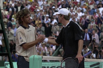 11Jun 2000: Gustavo Kuerton of Brazil (left) after his  victory over Magnus Norman of Sweden  in the Mens Singles Final at the  French Open, Roland Garros, Paris, France. Mandatory Credit: Clive Brunskill/ALLSPORT