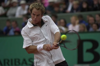 11Jun 2000:  Magnus Norman of Sweden gets in a backhand whilst  being beaten by Gustavo kuerton of Brazil in the Mens Singles Final at the  French Open, Roland Garros, Paris, France. Mandatory Credit: Clive Brunskill/ALLSPORT