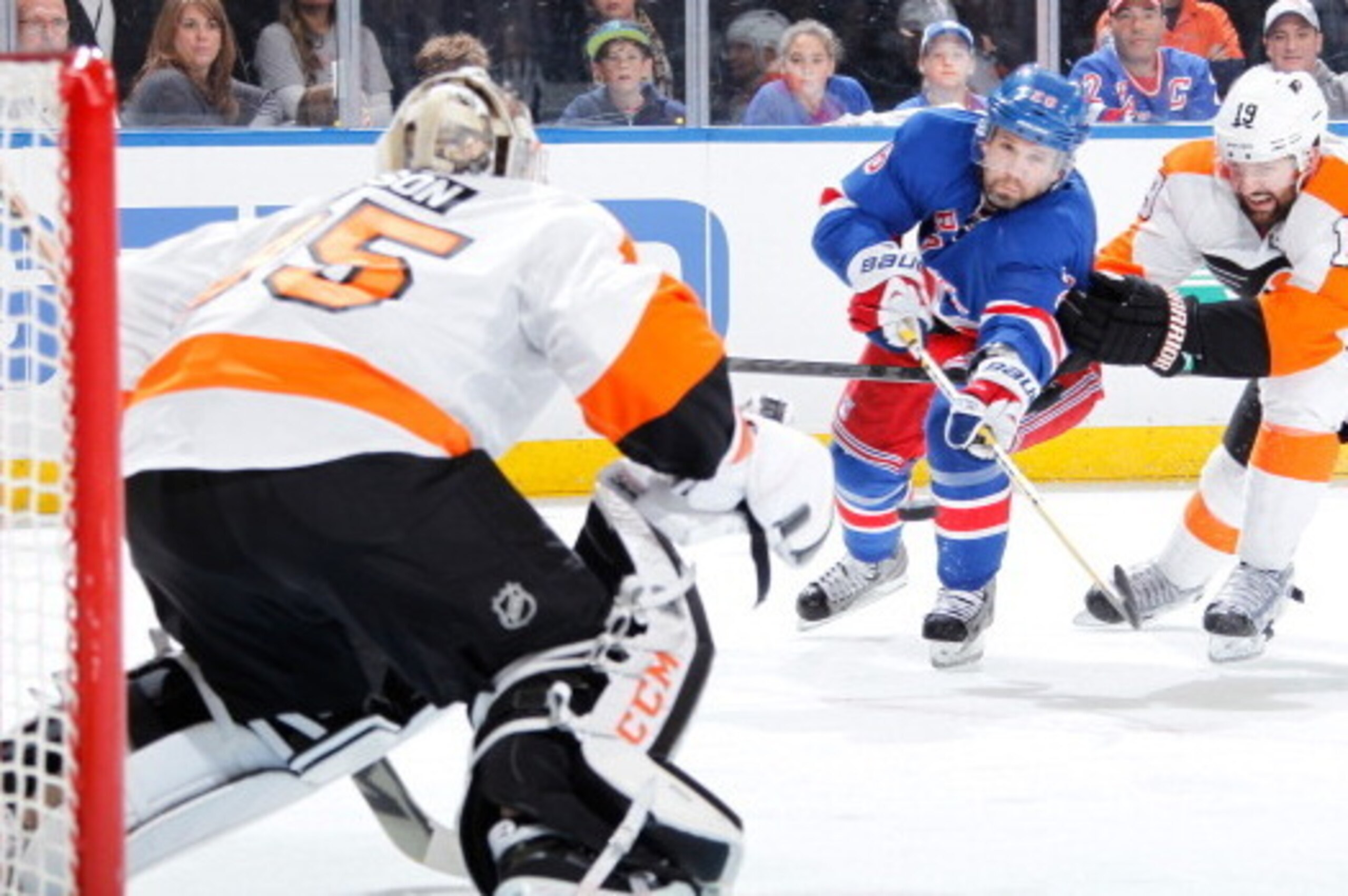 NEW YORK, NY - APRIL 27:  Martin St. Louis #26 of the New York Rangers shoots the puck on goal against Steve Mason #35 of the Philadelphia Flyers in Game Five of the First Round of the 2014 Stanley Cup Playoffs at Madison Square Garden on April 27, 2014 i