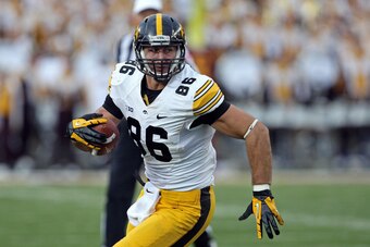 Sep 28, 2013; Minneapolis, MN, USA; Iowa Hawkeyes tight end C.J. Fiedorowicz (86) runs with the ball after making a catch in the second half against the Minnesota Golden Gophers at TCF Bank Stadium. The Hawkeyes won 23-7. Mandatory Credit: Jesse Johnson-U