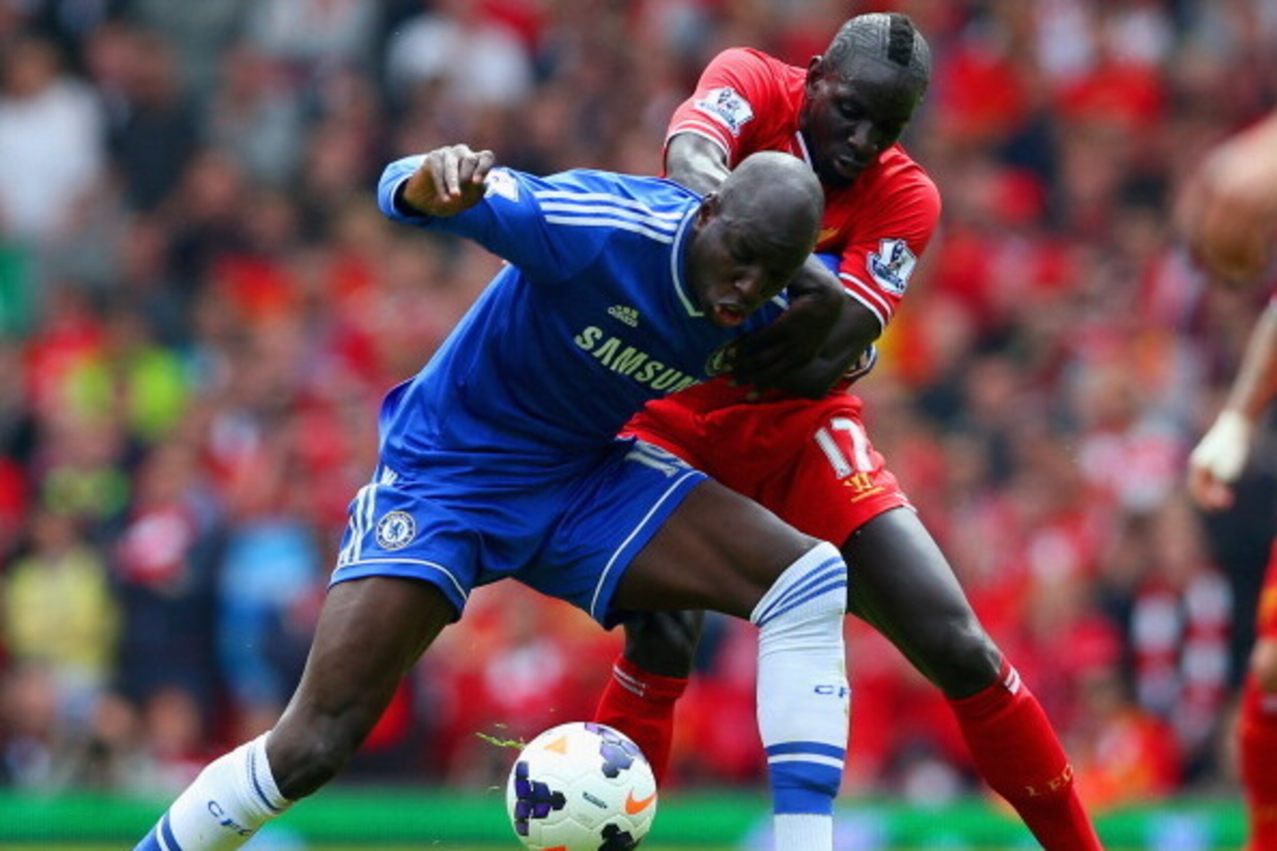 LIVERPOOL, ENGLAND - APRIL 27:  Demba Ba of Chelsea and Mamadou Sakho of Liverpool  battle for the ball during the Barclays Premier League match between Liverpool and Chelsea at Anfield on April 27, 2014 in Liverpool, England.  (Photo by Clive Brunskill/G