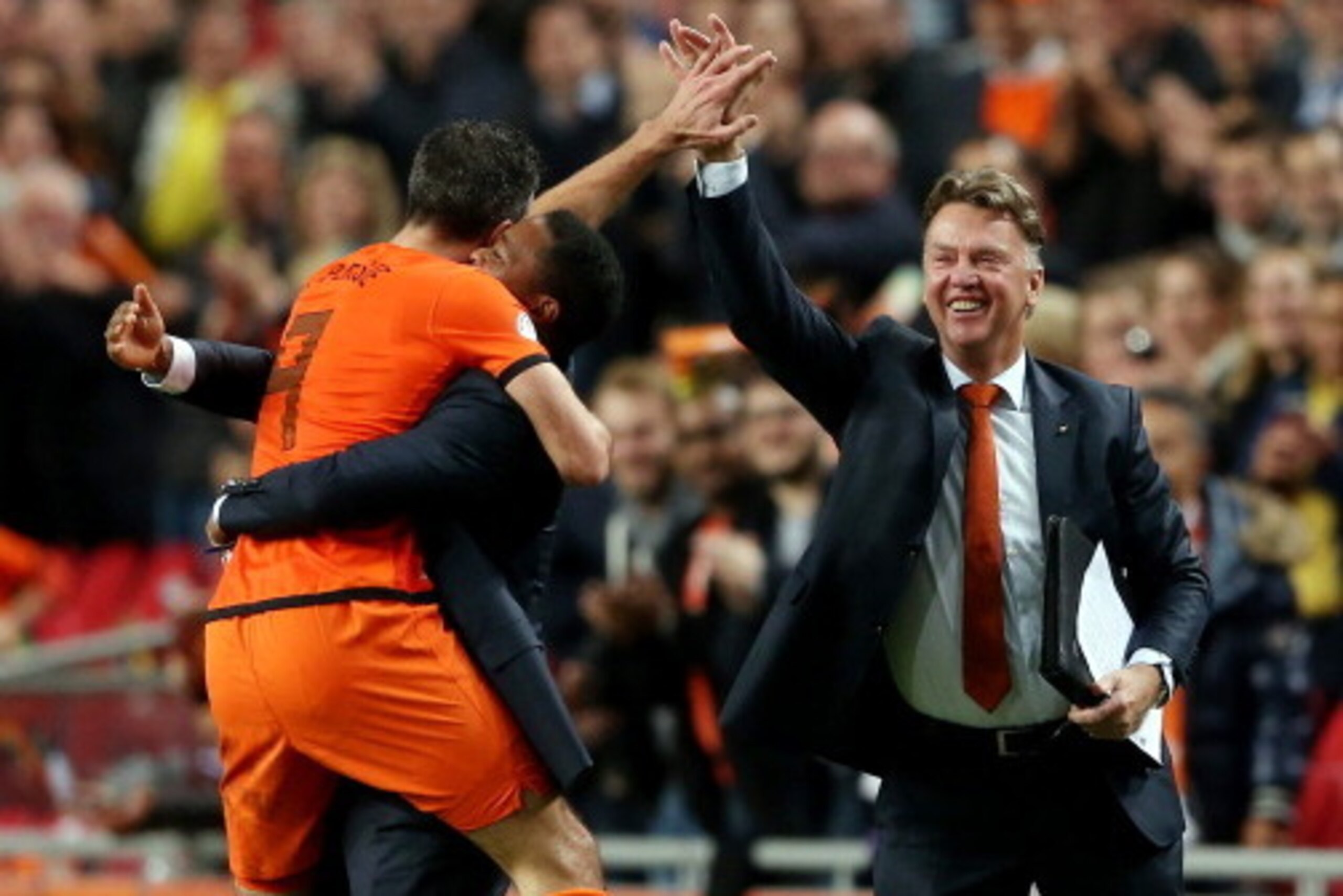 AMSTERDAM, NETHERLANDS - OCTOBER 11:  Robin van Persie of Holland celebrates with Patrick Kluivert and manager Luis van Gaal after scoring their fourth goal during the FIFA 2014 World Cup Qualifing match between Holland and Hungary at Amsterdam Arena on O