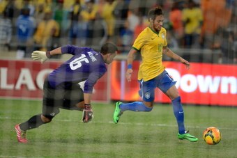 JOHANNESBURG, SOUTH AFRICA - MARCH 05:  Ronwen Williams of South Africa and Neymar of Brazil in action during the International Friendly match between South Africa and Brazil at FNB Stadium on March 05, 2014 in Johannesburg, South Africa. (Photo by Lefty 