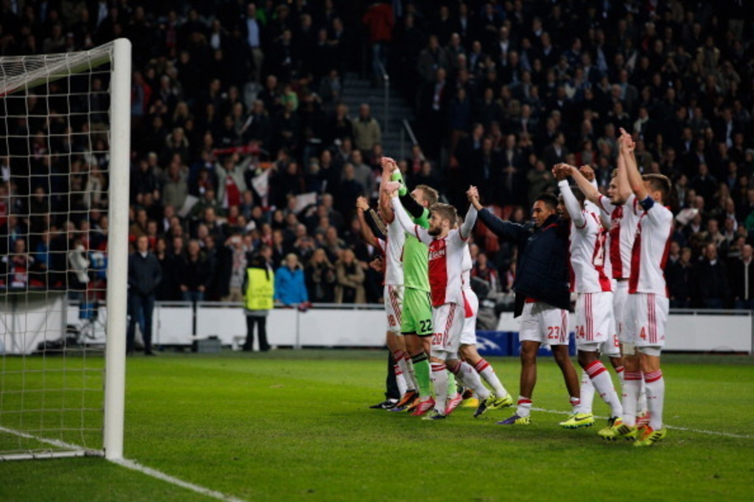 AMSTERDAM, NETHERLANDS - NOVEMBER 26:  Ajax players celebrate victory after the UEFA Champions League Group H match between Ajax Amsterdam and FC Barcelona at Amsterdam Arena on November 26, 2013 in Amsterdam, Netherlands.  (Photo by Dean Mouhtaropoulos/G