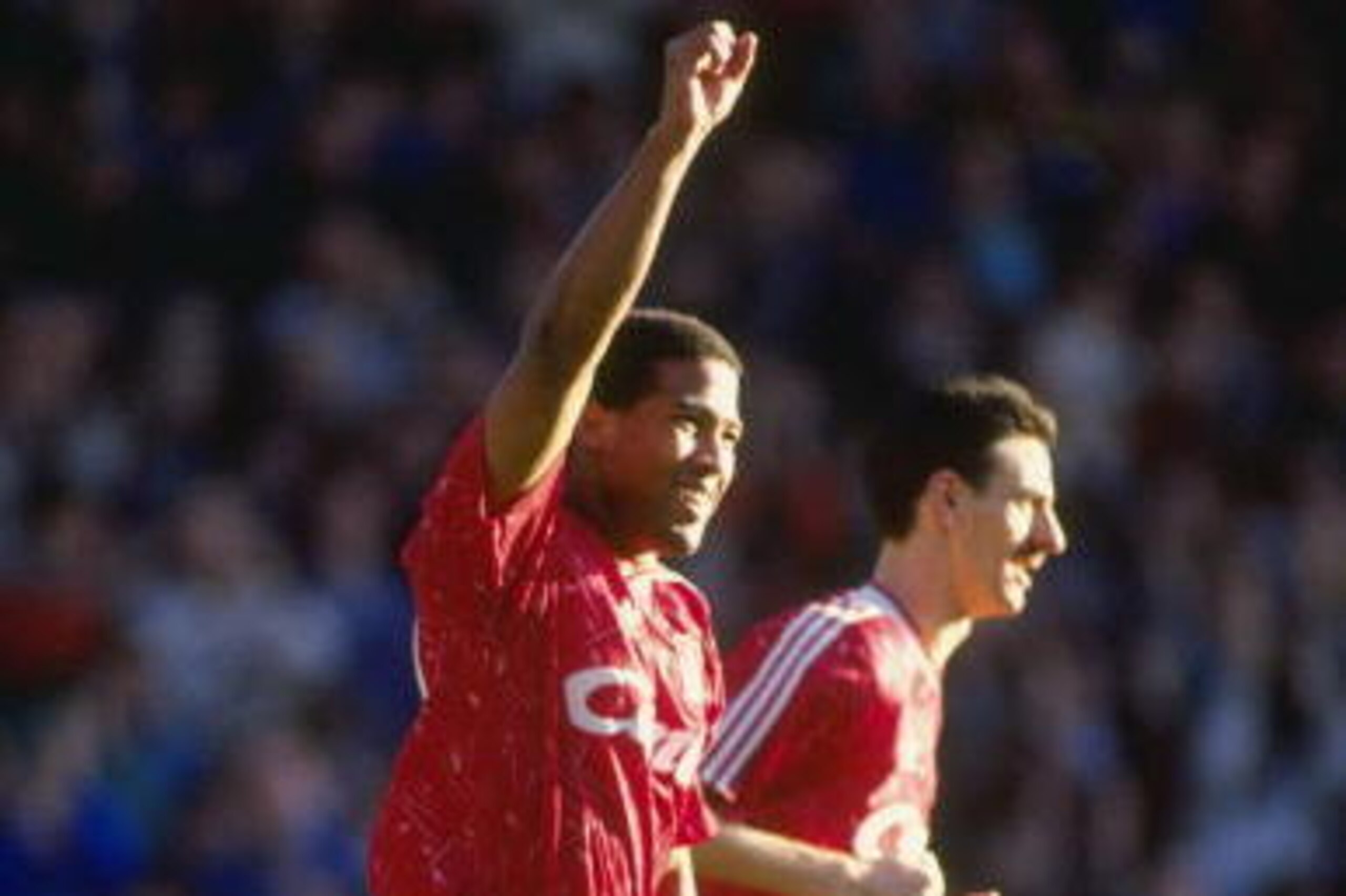 3 Feb 1990:  John Barnes of Liverpool and teammate Ian Rush acknowledge the crowd after a goal in the derby match against Everton at Anfield in Liverpool. Mandatory Credit: Ben Radford/Allsport