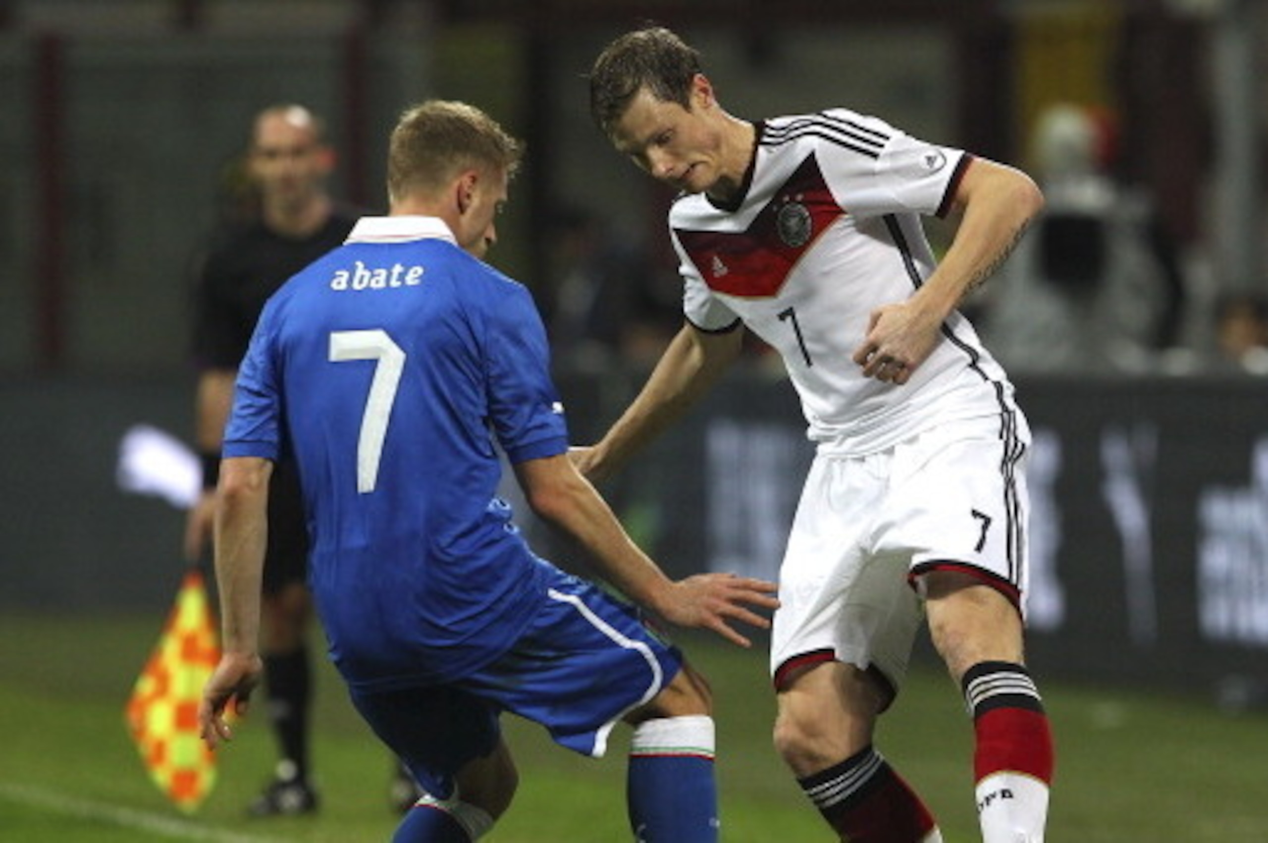 MILAN, ITALY - NOVEMBER 15:  Marcell Jansen (R) of Germany compete for the ball with Ignazio Abate (L) of Italy during the international friendly match between Italy and Germany at Giuseppe Meazza Stadium on November 15, 2013 in Milan, Italy.  (Photo by M