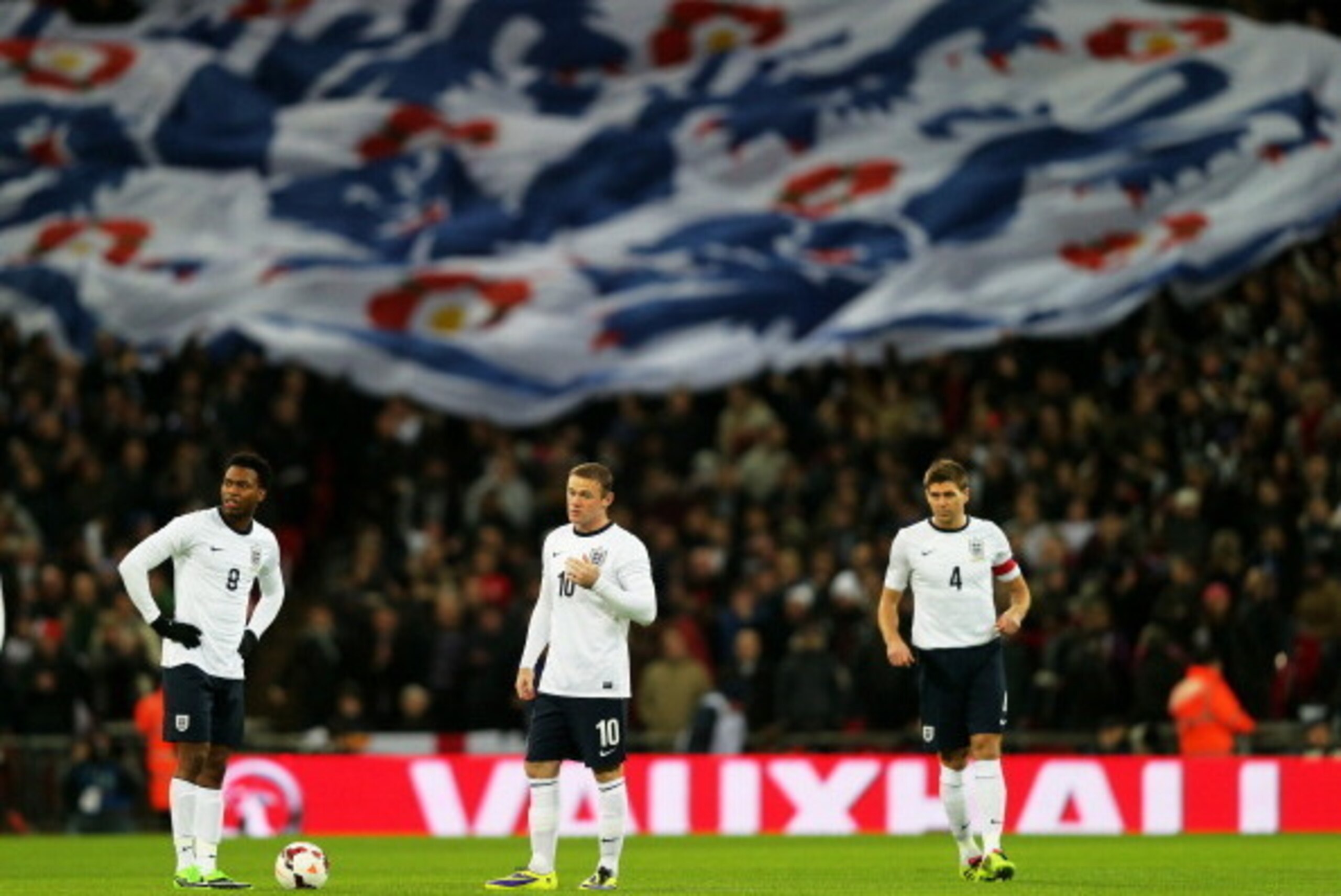 LONDON, ENGLAND - NOVEMBER 19:  (L-R) Daniel Sturridge, Wayne Rooney and Steven Gerrard of England look on prior to the international friendly match between England and Germany at Wembley Stadium on November 19, 2013 in London, England.  (Photo by Clive R