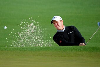Apr 9, 2014; Augusta, GA, USA; Jimmy Walker hits out of a bunker on the 2nd hole during a practice round for the 2014 The Masters golf tournament at Augusta National Golf Club. Mandatory Credit: Jack Gruber-USA TODAY Sports