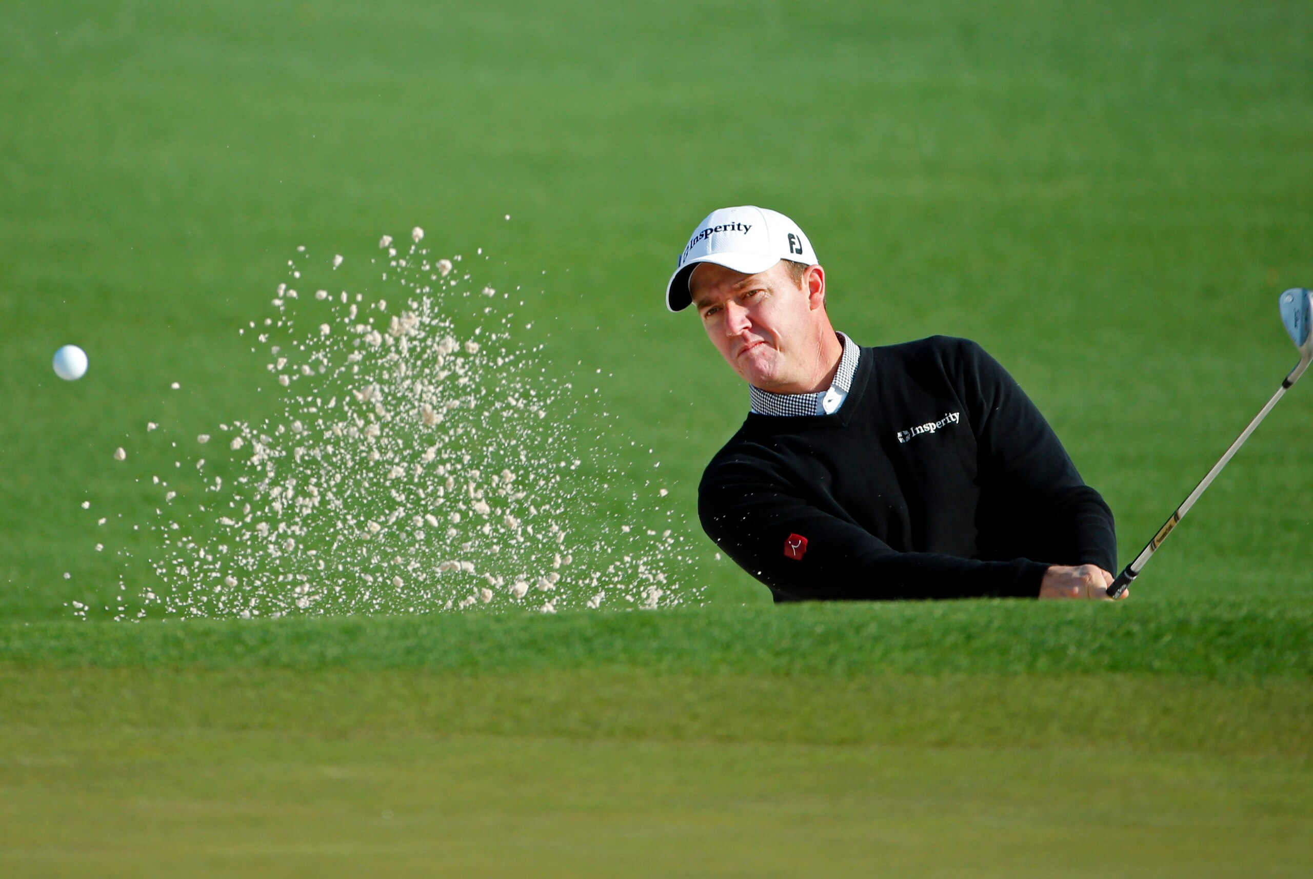 Apr 9, 2014; Augusta, GA, USA; Jimmy Walker hits out of a bunker on the 2nd hole during a practice round for the 2014 The Masters golf tournament at Augusta National Golf Club. Mandatory Credit: Jack Gruber-USA TODAY Sports