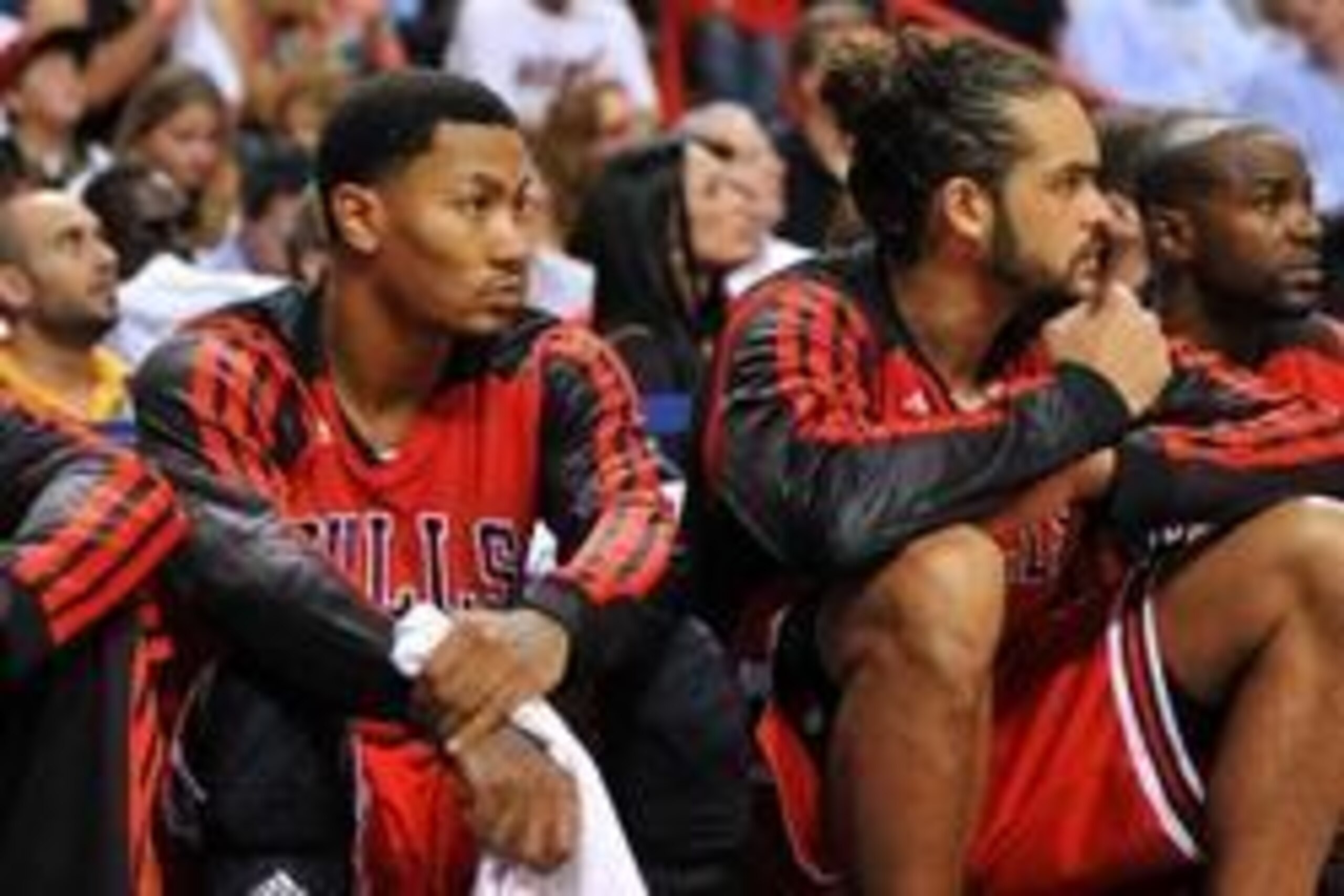 Oct 29, 2013; Miami, FL, USA; Chicago Bulls point guard Derrick Rose (left) sits in the bench next to center Joakim Noah (right) during the second half against the Miami Heat at American Airlines Arena. Miami won 107-95. Mandatory Credit: Steve Mitchell-U