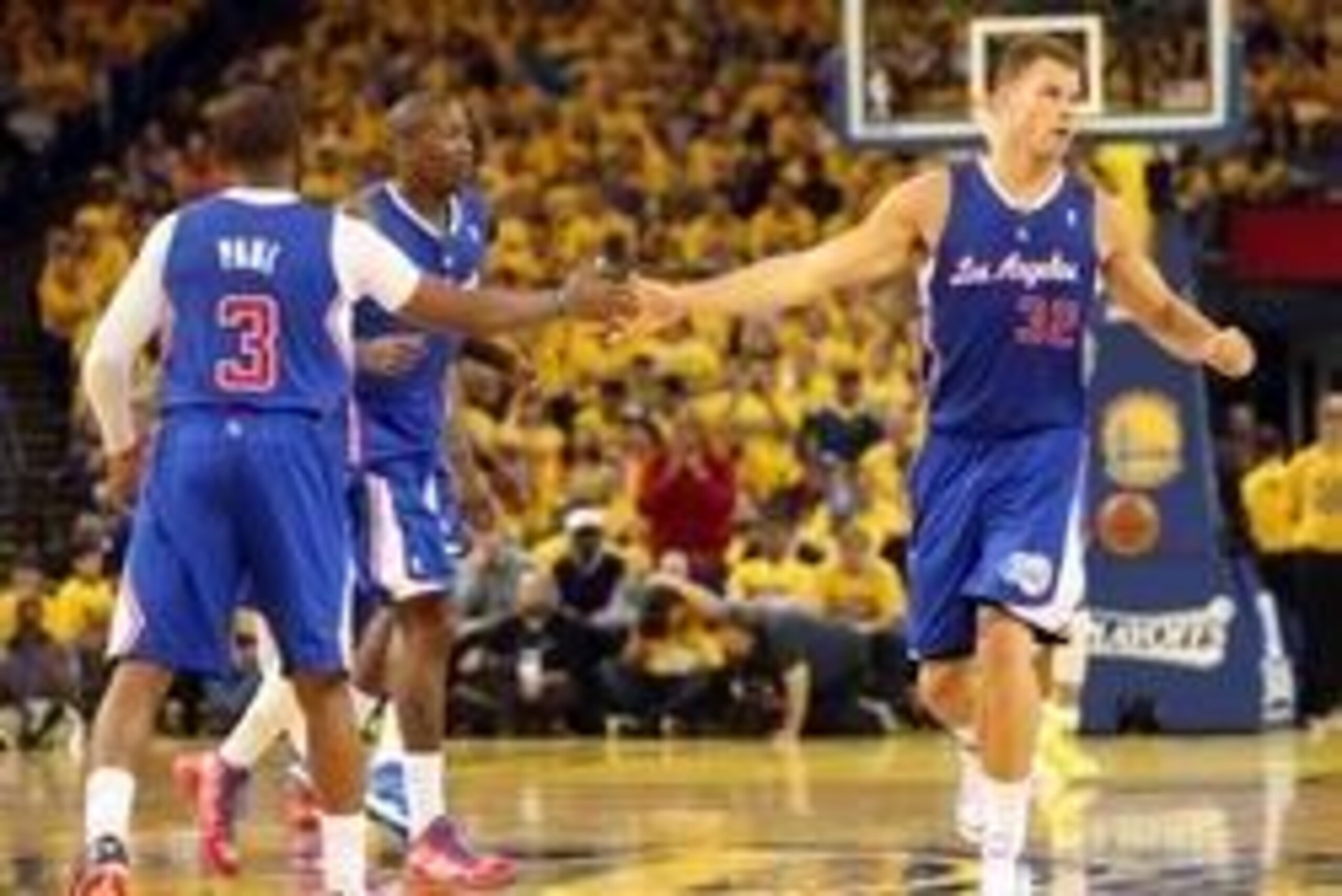 Apr 24, 2014; Oakland, CA, USA; Los Angeles Clippers forward Blake Griffin (32) high fives guard Chris Paul (3) after a play against the Golden State Warriors during the second quarter of game three of the first round of the 2014 NBA Playoffs at Oracle Ar