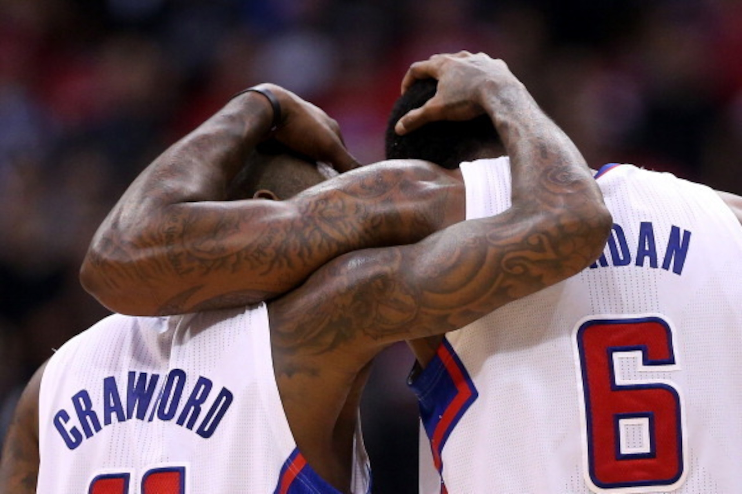 LOS ANGELES, CA - APRIL 29:  Jamal Crawford #11 and DeAndre Jordan #6 of the Los Angeles Clippers embrace during the final minute against the Golden State Warriors in Game Five of the Western Conference Quarterfinals during the 2014 NBA Playoffs at Staple