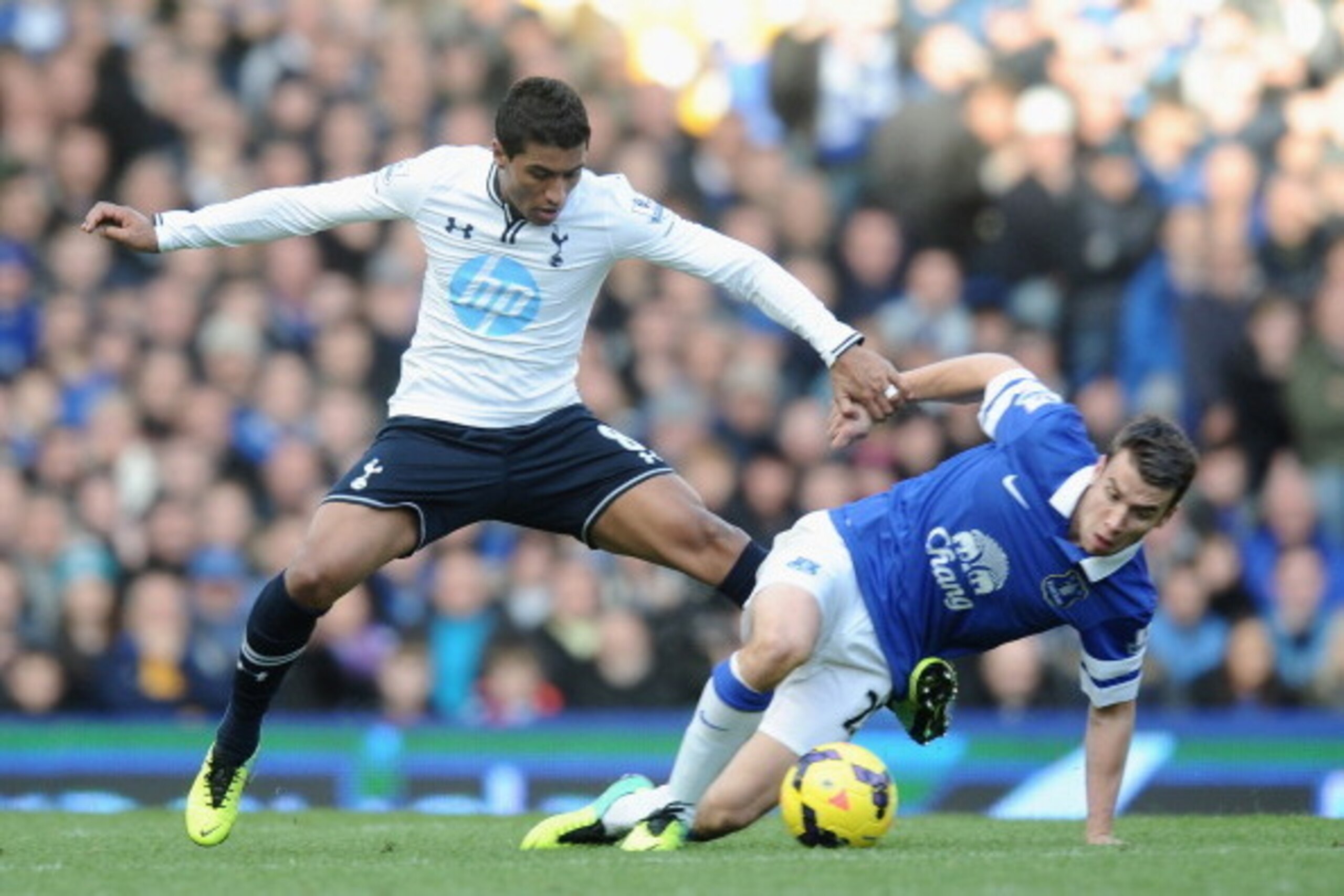 LIVERPOOL, ENGLAND - NOVEMBER 03:  Seamus Coleman of Everton tackled by Paulinho of Tottenham Hotspur during the Barclays Premier League match between Everton and Tottenham Hotspur at Goodison Park on November 3, 2013 in Liverpool, England.  (Photo by Ton
