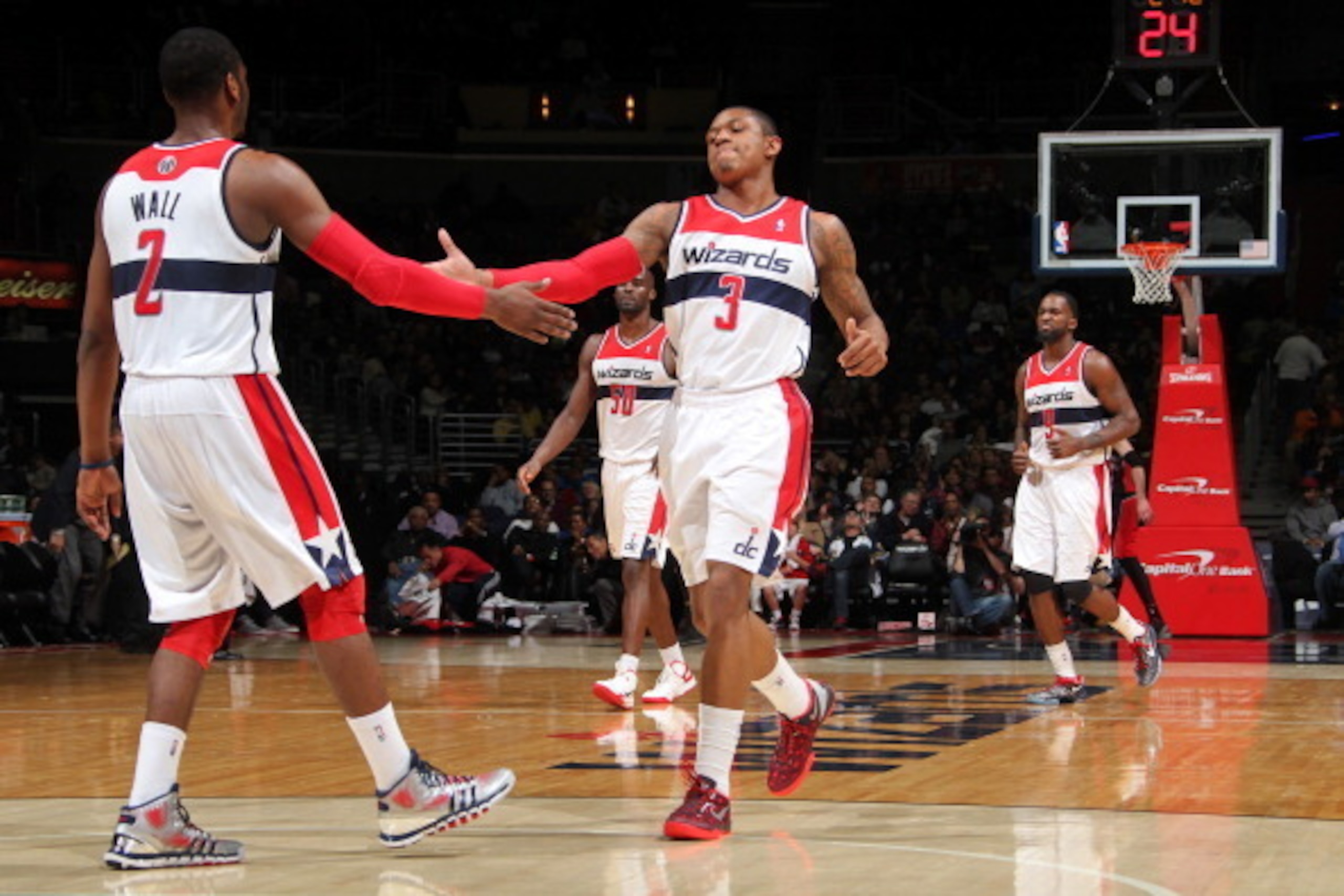 WASHINGTON, DC - MARCH 31: Bradley Beal #3 and John Wall #2 of the Washington Wizards celebrate during the game against the Toronto Raptors at the Verizon Center on March 31, 2013 in Washington, DC. NOTE TO USER: User expressly acknowledges and agrees tha WASHINGTON, DC - MARCH 31: Bradley Beal #3 and John Wall #2 of the Washington Wizards celebrate during the game against the Toronto Raptors at the Verizon Center on March 31, 2013 in Washington, DC. NOTE TO USER: User expressly acknowledges and agrees tha