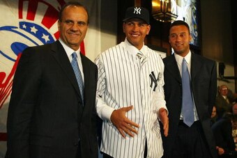 NEW YORK - FEBRUARY 17:  (L to R) Manager Joe Torre, Alex Rodriguez and Derek Jeter at a press conference that announced Rodriguez as the newest New York Yankee on February 17, 2004 at Yankee Stadium in the Bronx, New York.  (Photo by Ezra Shaw/Getty Imag