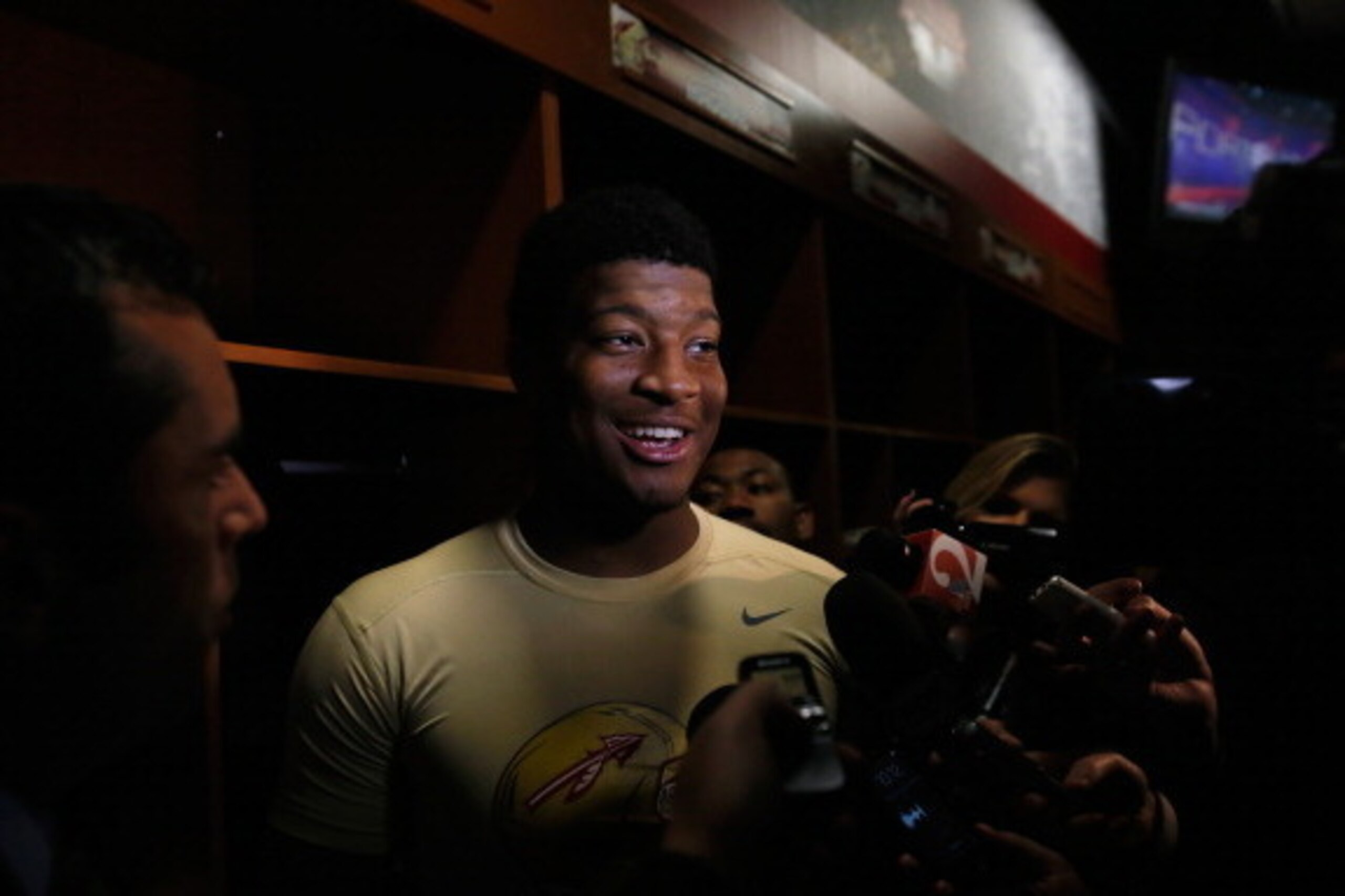 PASADENA, CA - JANUARY 06:  Quarterback Jameis Winston #5 of the Florida State Seminoles celebrates in the locker room after defeating the Auburn Tigers 34-31 in the 2014 Vizio BCS National Championship Game at the Rose Bowl on January 6, 2014 in Pasadena